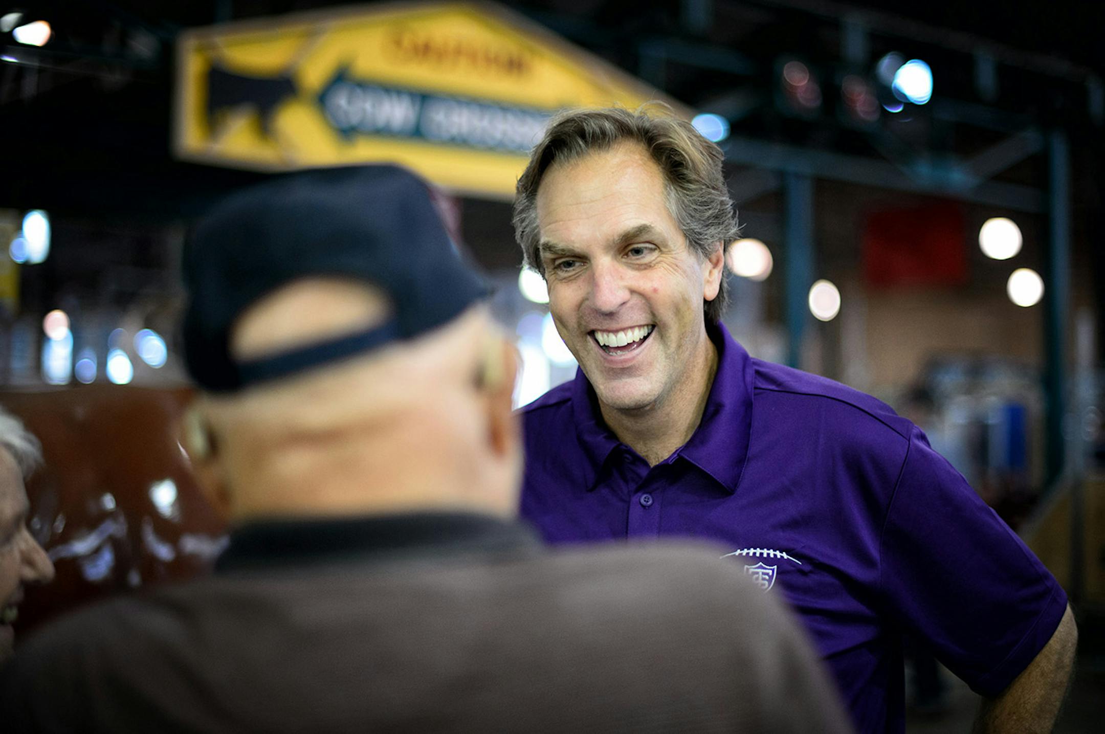 GOP Senate candidate Mike McFadden laughed with Larry and Evy Walters of Brooklyn Park in the State Fair Cattle Barn. Larry Walters then asked if he could see son Connor's scar from where Mike removed the stitches, featured in his current Television ad. ] Falcon Heights , MN -- Thursday, August 28, 2014. GLEN STUBBE * gstubbe@startribune.com