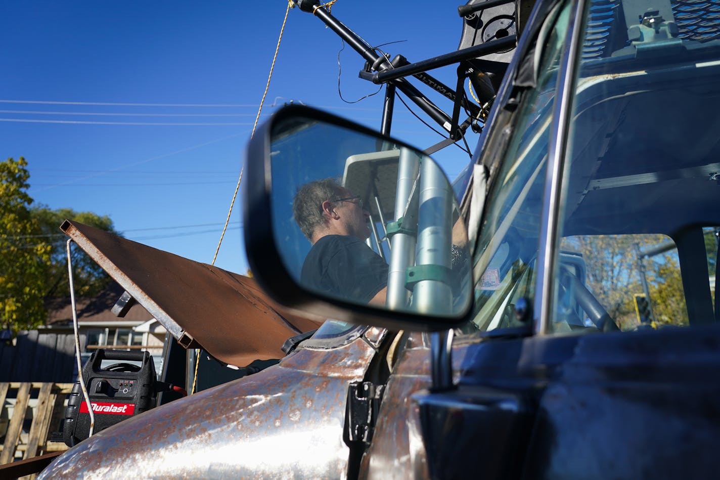 Stuart DeVann's profile was seen in a side view mirror while prepping the van for a Nur-D and DJ Hayes "Bands on Vans" concert. ] Shari L. Gross ¥ shari.gross@startribune.com "Rock 'n' roll" takes on new meaning with "Bands on Vans," a new concert series on community station MCN6 that takes place on a van with a stage and sidebars built on top of it. The bands perform as the van steadily rolls along at 5 mph max, starting at Grumpy's and ending at the 331 Club in Northeast Minneapolis (both bars