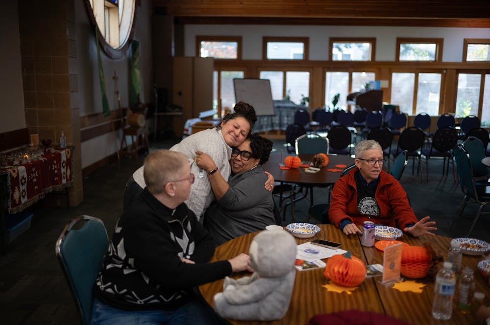 The Rev. Jen Collins hugs Rev. Jia Starr Brown at All Nations Indian Church in Minneapolis on Wednesday.