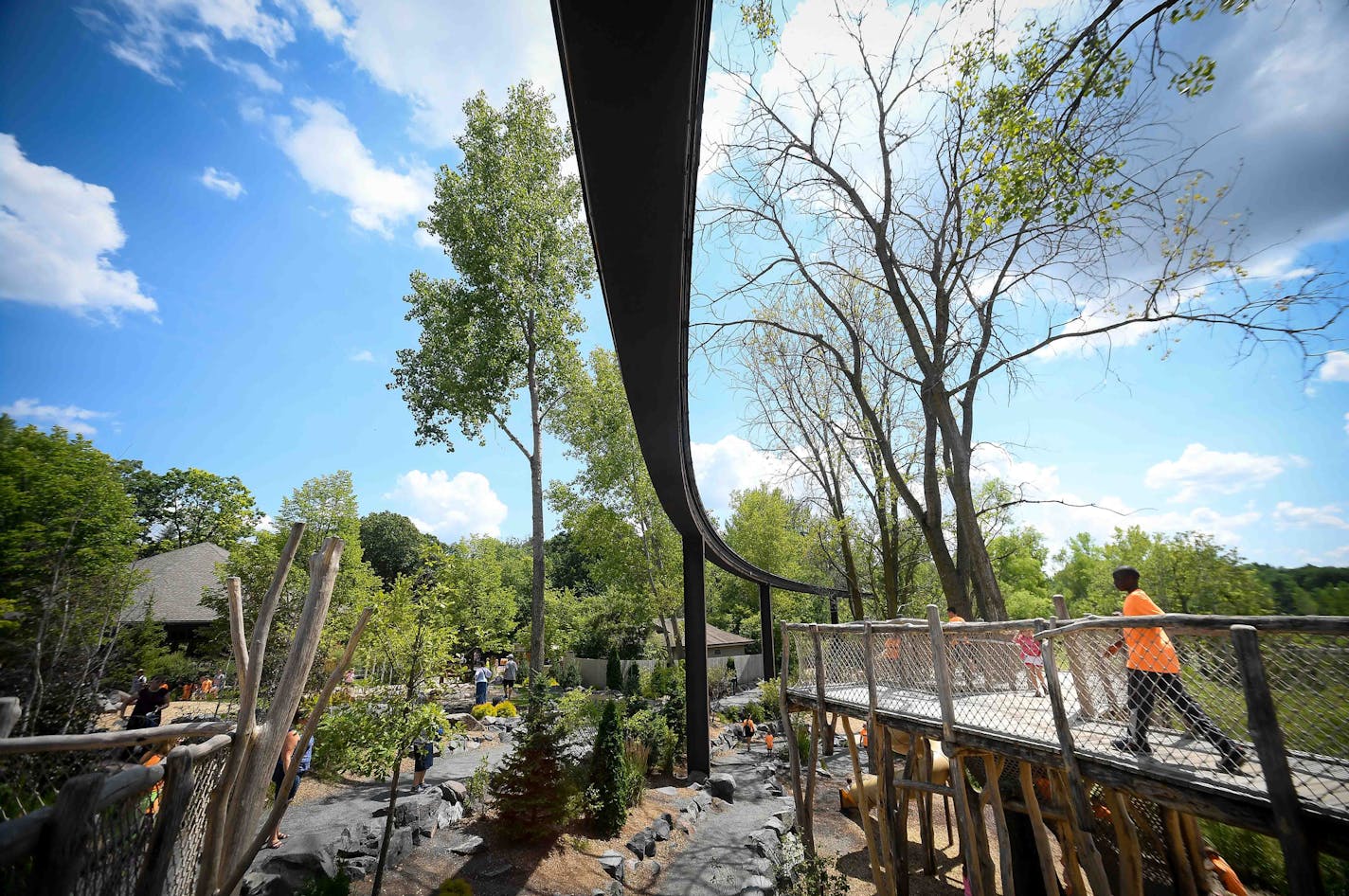 The defunct monorail track passes above the Hanifl Family Wild Woods Play Area as seen Thursday afternoon. ] AARON LAVINSKY &#xef; aaron.lavinsky@startribune.com Zoo director John Frawley dreams of converting the defunct Monorail into a boardwalk overlooking the exhibits (think NYC's Hi-line) and partnering with the DNR, Girl Scouts and others to provide camping opportunities on the zoo's underutilized land. It's all part of a massive push to better connect Minnesotans with nature. We photograph