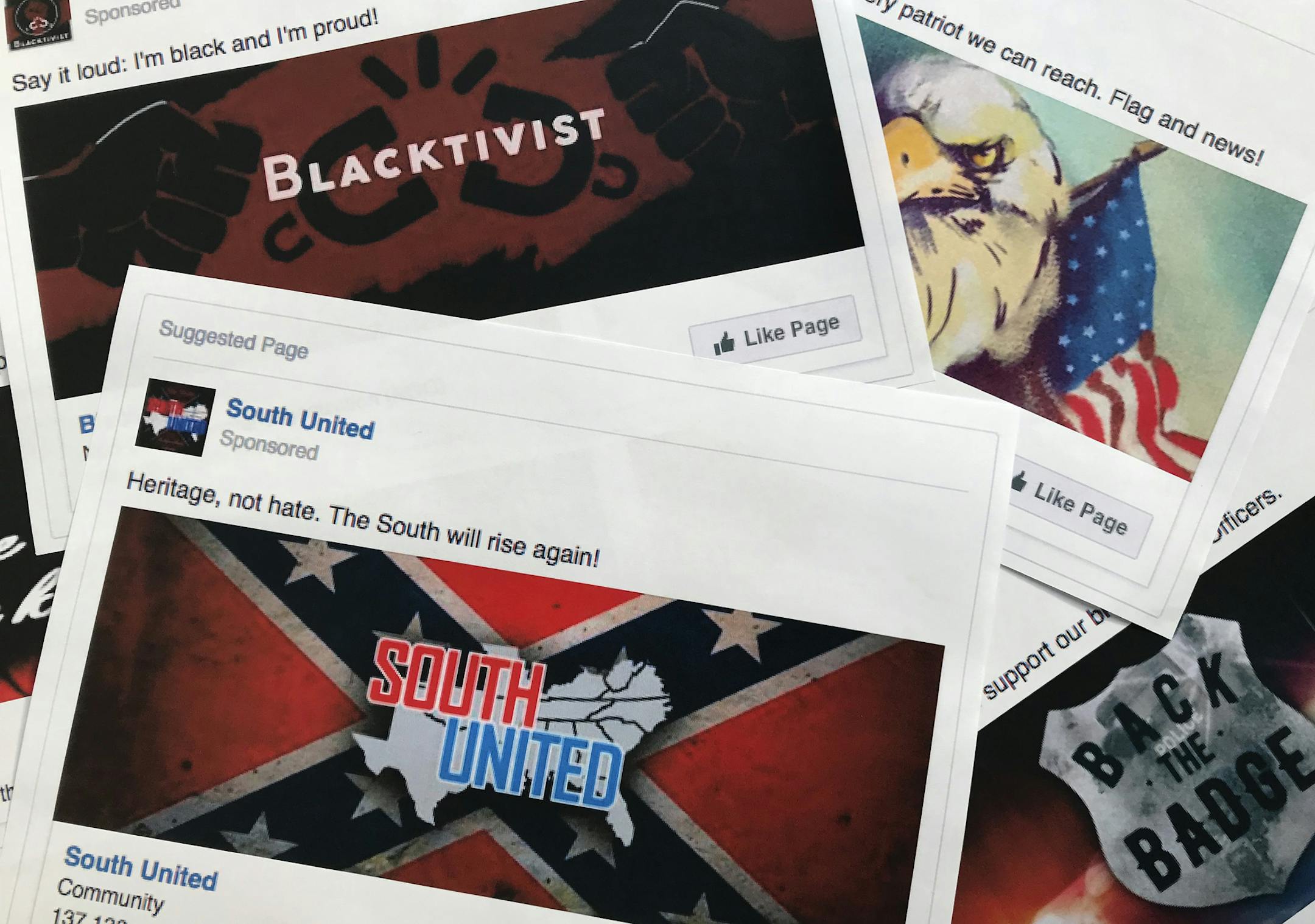Some of the Facebook ads linked to a Russian effort to disrupt the American political process and stir up tensions around divisive social issues, released by members of the U.S. House Intelligence committee, are photographed in Washington, on Wednesday, Nov. 1, 2017. The ads, dozens of which were disclosed for the first time, were released as representatives of leading social media companies faced criticism on Capitol Hill about why they hadn't done more to combat Russian interference on their s