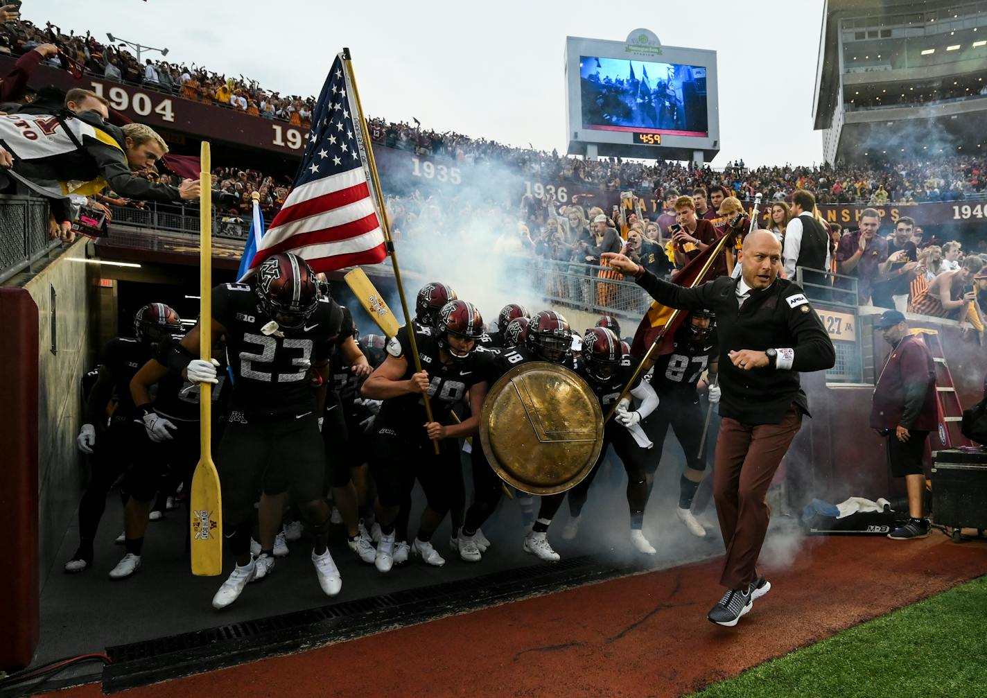 Gophers head coach P.J. Fleck took the field with his team before Thursday night's game against the Ohio State Buckeyes.