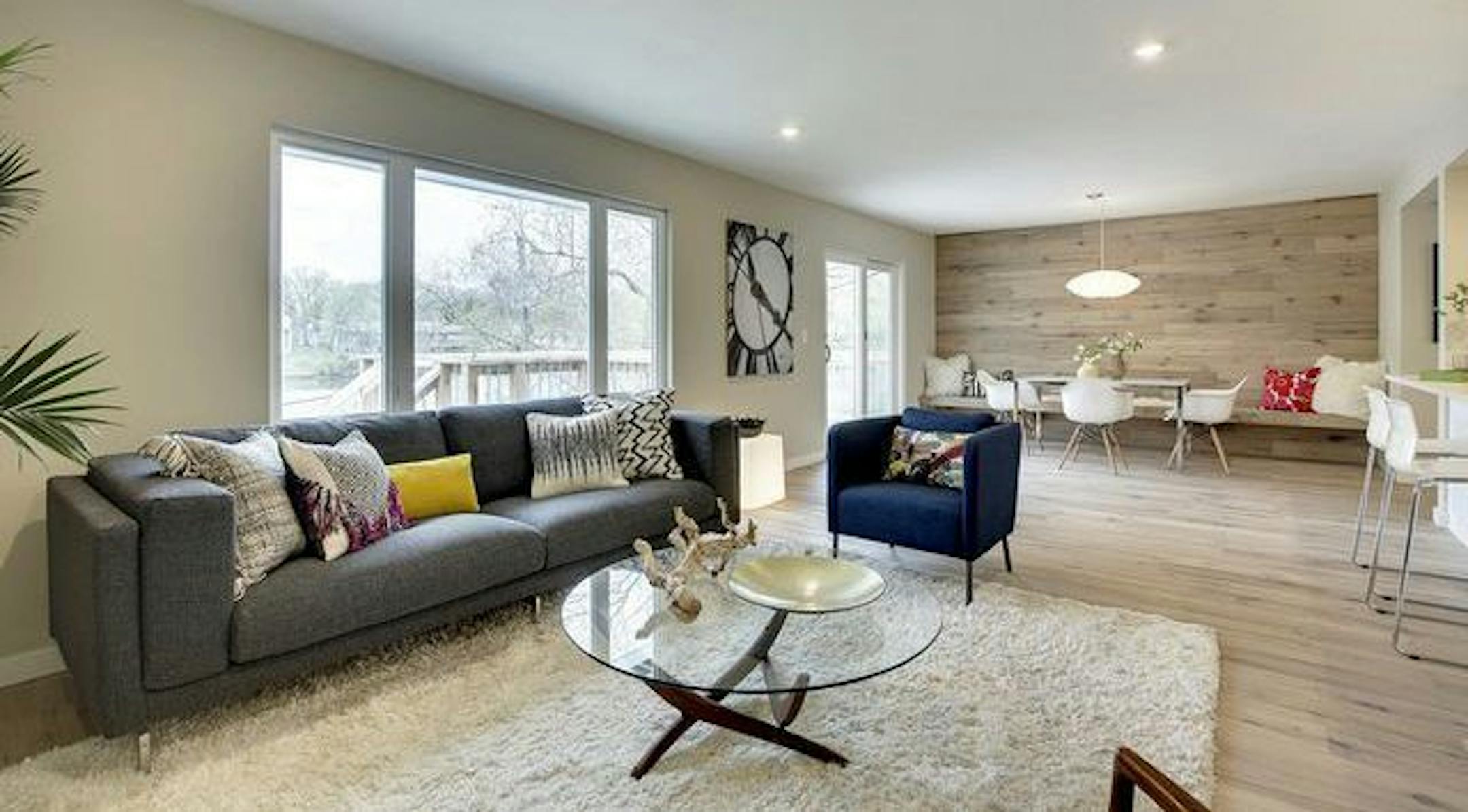 The design for the makeover was inspired by Finnish lake homes of the 1960s. Windows were enlarged to capture views of the backyard pond.