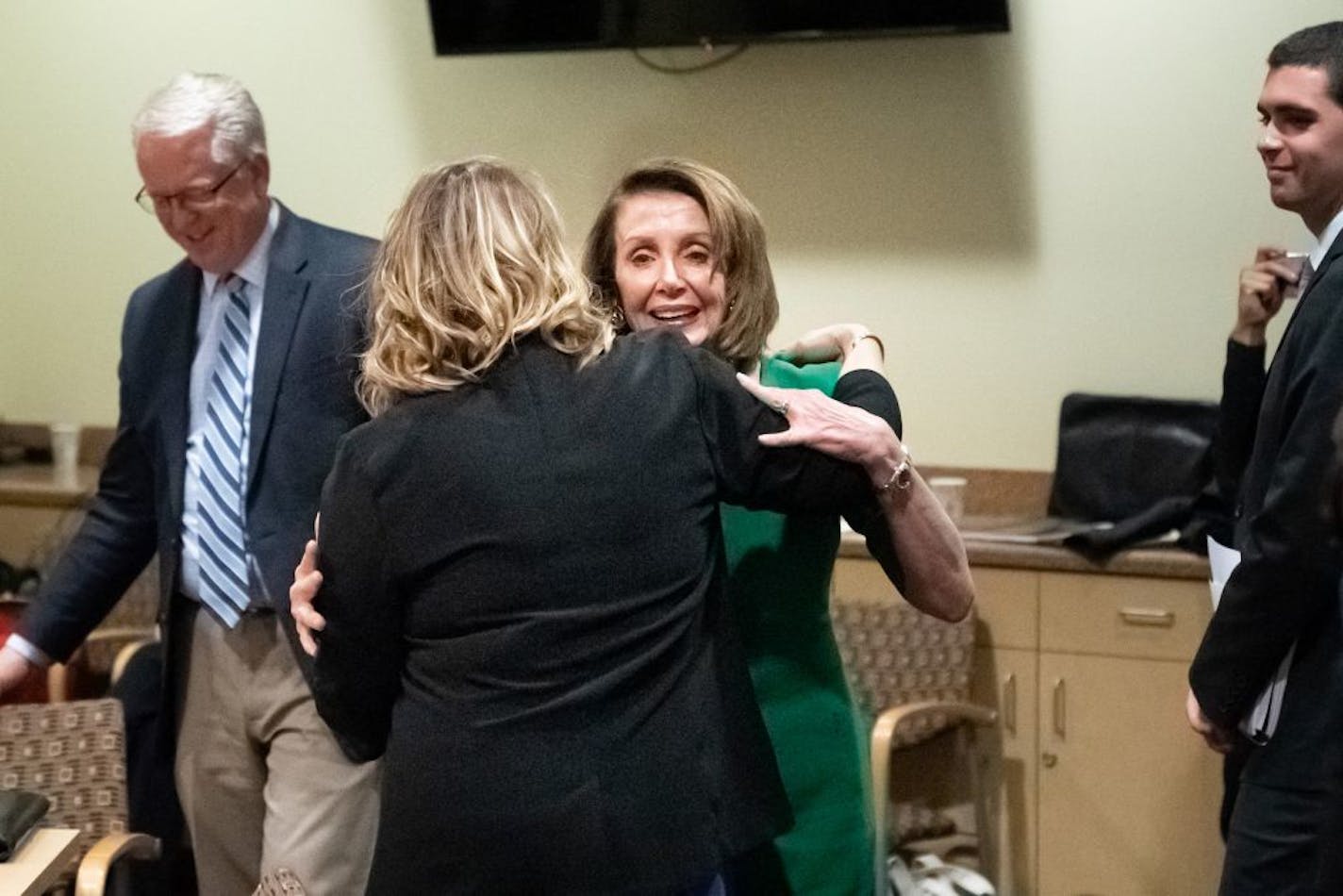 Speaker of the U.S. House of Representatives Nancy Pelosi greeted Lt Governor Peggy Flanagan with a hug. She participated in a Roundtable at the Wellstone Center in St. Paul, exploring ways to strengthen community health centers along with Congresswoman Betty McCollum, Lt. Governor Peggy Flanagan and representatives from Minnesota community health centers. Later House Speaker Pelosi speaks at a DFL fundraising dinner.