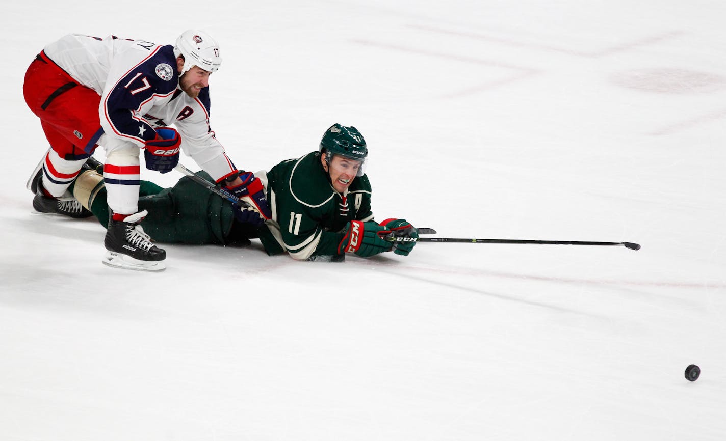 Columbus Blue Jackets defenseman Brandon Dubinsky (17) takes down Minnesota Wild left wing Zach Parise (11) during the first period last weekend.