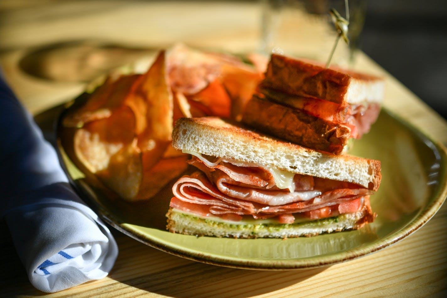 Fra' Mani Fried Bologna ] GLEN STUBBE &#x2022; glen.stubbe@startribune.com Friday February 17, 2017 Punch Bowl Social, a new Denver-based eatertainery chain, has landed at the Shops at West End in St. Louis park, with a Southern diner-inspired menu. Restaurant review. Please arrive before the lunch rush and shoot food: Pimiento cheese, black eyed pea hummus, knockoff burger, bologna sandwich, chicken and waffles, chips and dip. From bar: shrub and punch.