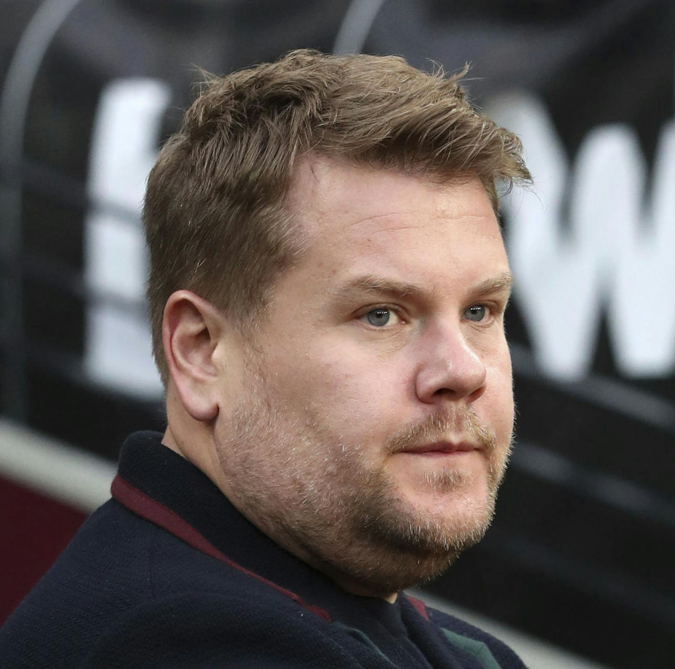 James Corden pitchside during the English Premier League soccer match between West Ham United and Watford at London Stadium in London, Saturday, Dec. 22, 2018. (Chris Radburn via AP)