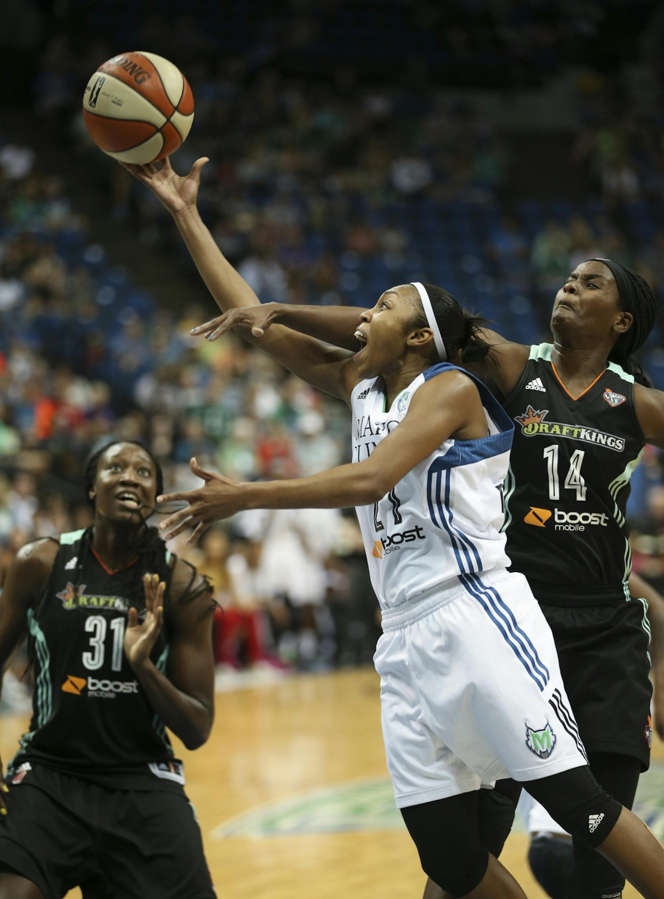 Minnesota Lynx guard Renee Montgomery (21) was fouled in the fourth quarter by New York Liberty guard Sugar Rodgers (14) Sunday night.