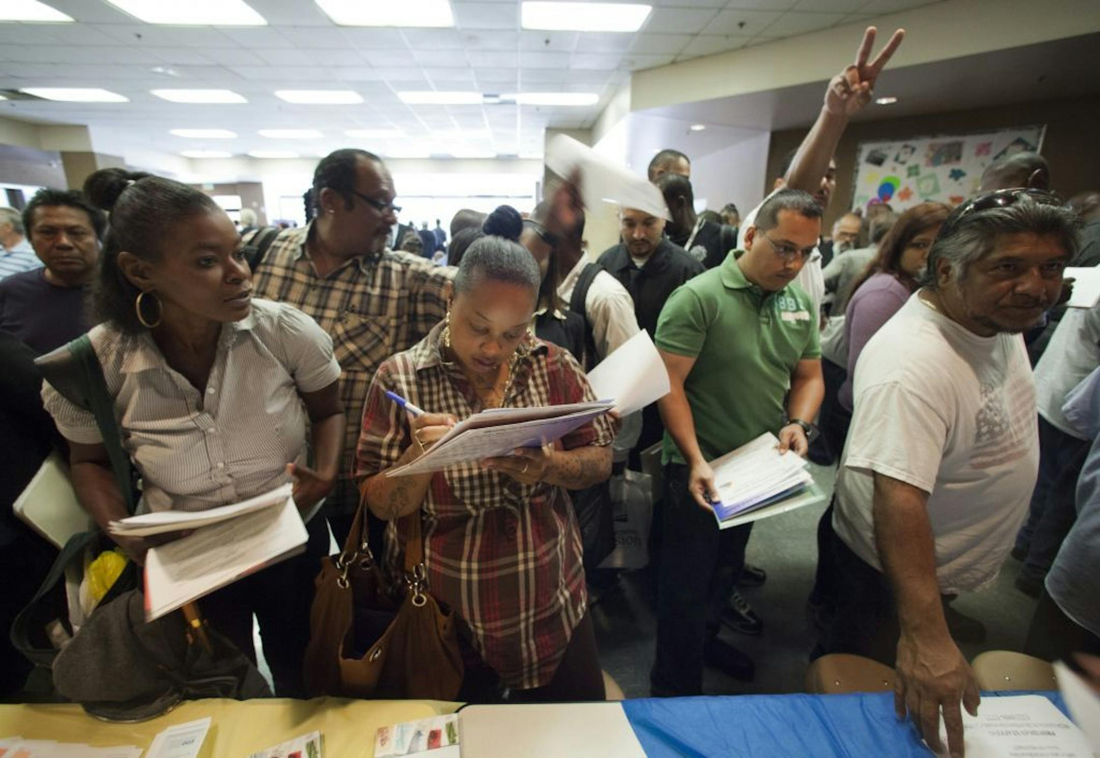 In this Thursday, May 31, 2012, job seekers gather for employment opportunities at the 11th annual Skid Row Career Fair at the Los Angeles Mission in Los Angeles.U S. employers advertised more jobs in May than April, a hopeful sign after three months of weak hiring. Job openings rose to a seasonally adjusted 3.6 million, the Labor Department said Tuesday, July 10, 2012. That's up from 3.4 million in April. It's also the second-highest level in nearly four years, just behind March's 3.7 million.