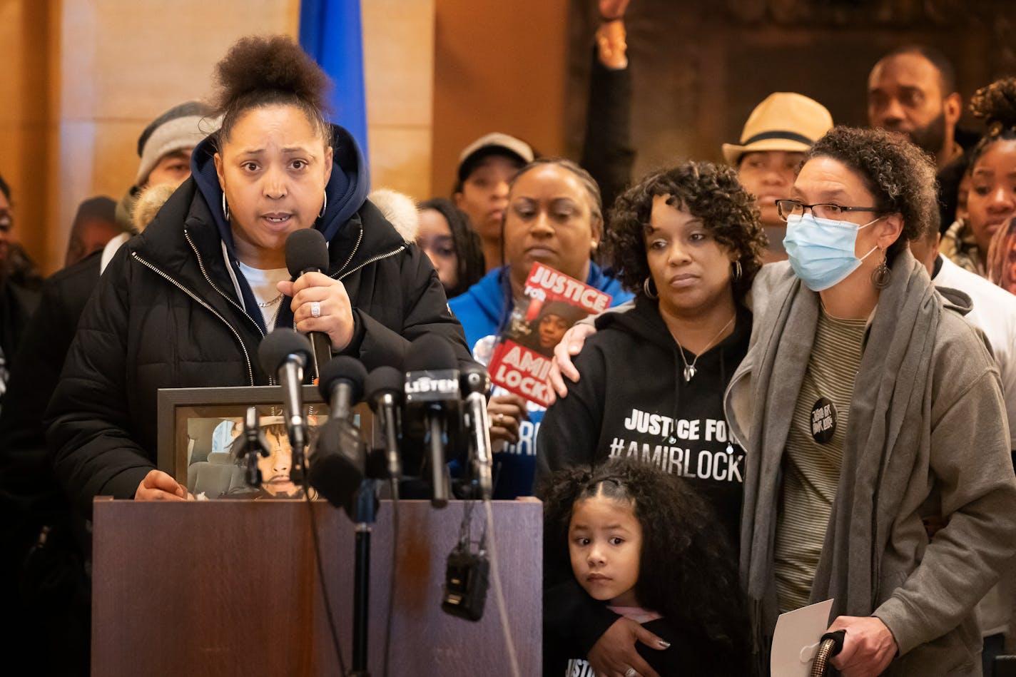 Monique Johnson, left, spoke of her dead son Howard Johnson as Amity Dimock, right hugged Amir Locke's mom Karen Wells, center, Thursday, Feb. 2, 2023 St. Paul, Minn. All three mothers had sons shot by the police. On the one year anniversary of Amir Locke killing by a police officer, family, activists held a rally at the State Capitol to demand accountability.