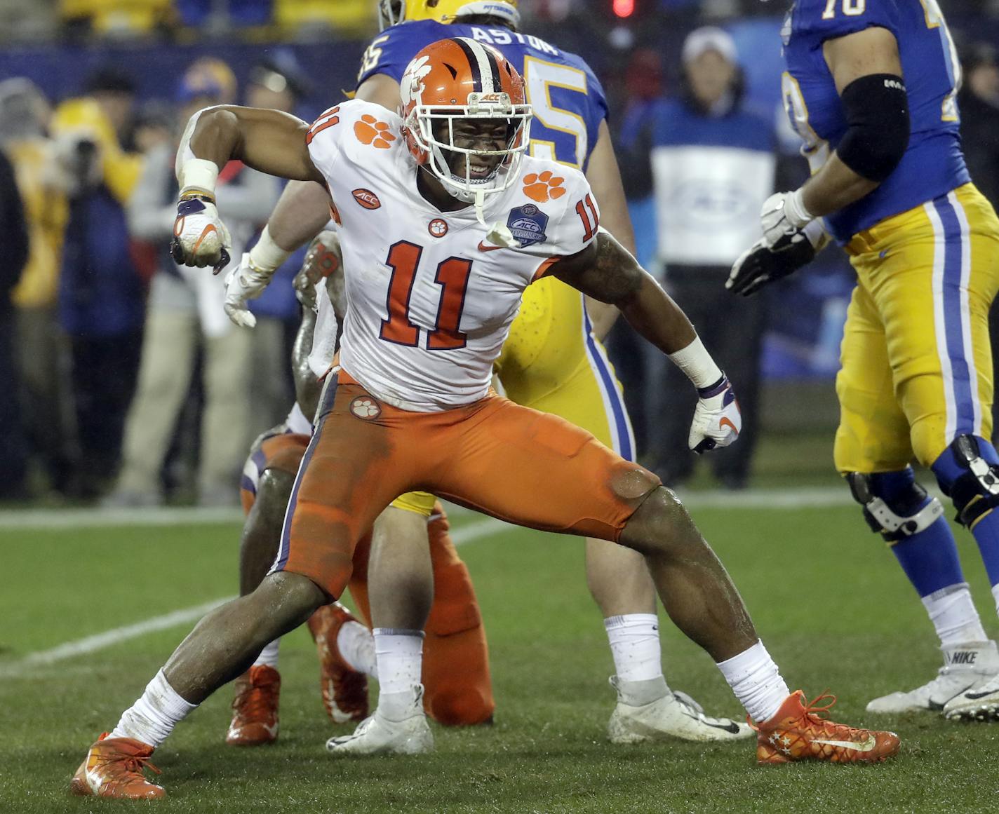 Clemson's Isaiah Simmons (11) reacts after making a play against Pittsburgh in the first half of the Atlantic Coast Conference championship NCAA college football game in Charlotte, N.C., Saturday, Dec. 1, 2018. (AP Photo/Chuck Burton) ORG XMIT: NYOTK