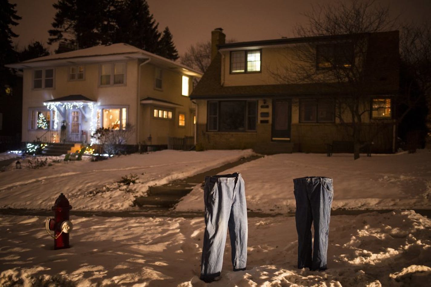 Frozen blue jeans were displayed on the front lawn of Tom Grotting on Columbia Parkway on Jan. 19, 2016, in Minneapolis. Grotting says he started putting out frozen jeans "for no good reason."