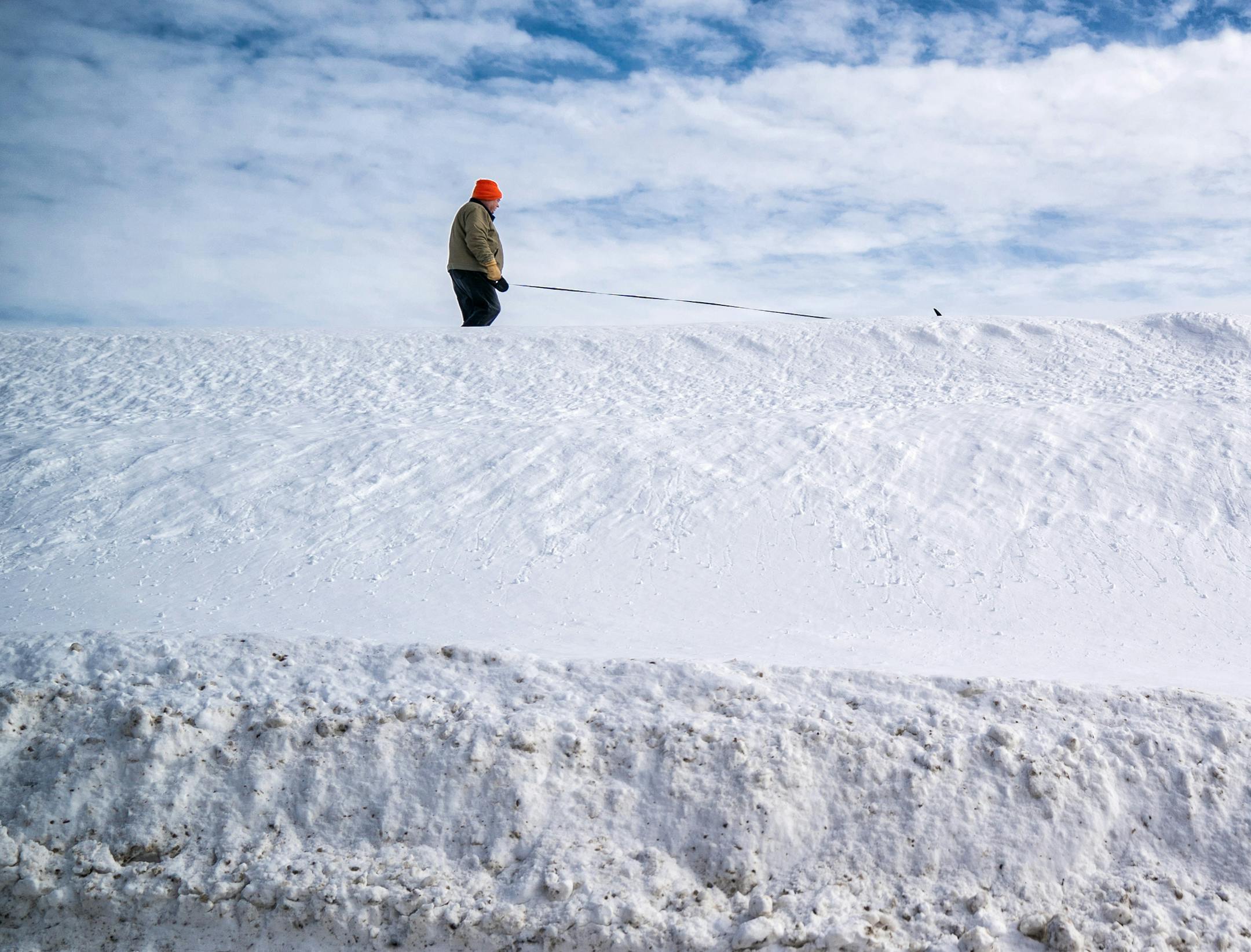 Mark Johnson of Chaska walks across the Carver, Minn. floodwall. As temperatures got out of single digits, warming to the 20's some puddles started to form, warning that flooding was a possibility this spring. Carver Minnesota is on the banks of the Minnesota River, high water poses a threat. ] GLEN STUBBE • glen.stubbe@startribune.com Thursday, February 28, 2019 Aside from all the backbreaking shoveling and nasty rush-hour commutes, February's record snowfall is set to bring yet more pai