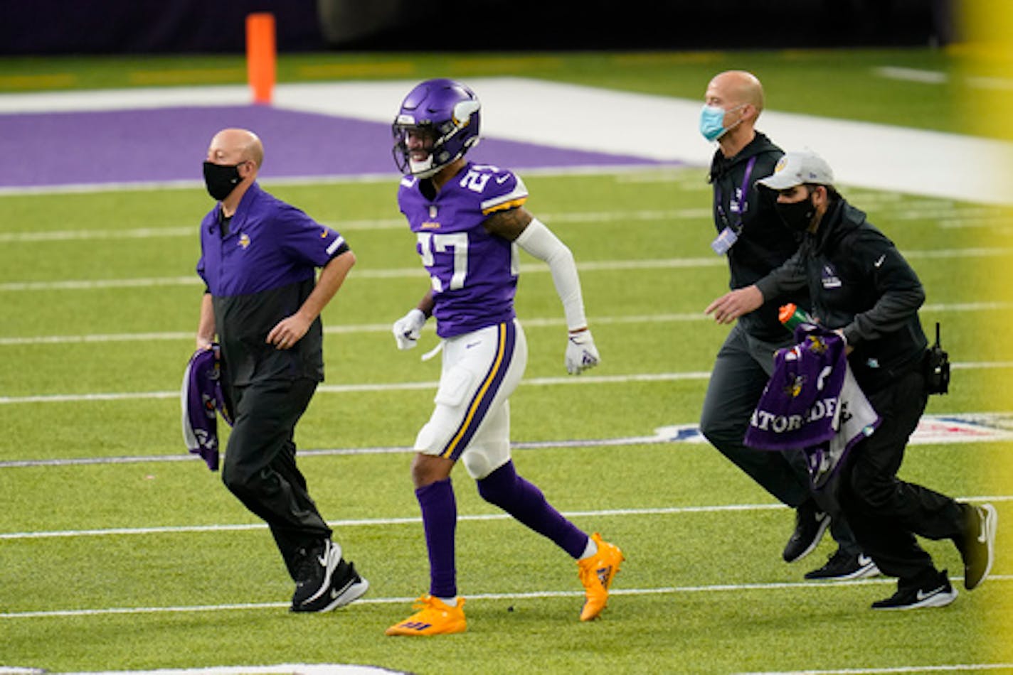 Minnesota Vikings cornerback Cameron Dantzler (27) is helped off the field after getting injured during the second half of an NFL football game against the Chicago Bears, Sunday, Dec. 20, 2020, in Minneapolis. (AP Photo/Jim Mone)