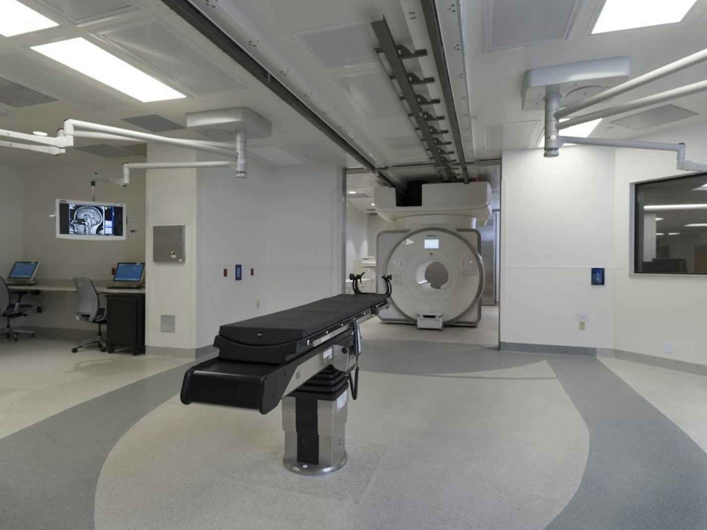 Pictured is an Imris Surgical Theater, which is a hospital operating room designed and built by Minnetonka-based Imris, Deerfield Imaging, Inc. The system includes a Siemens magnetic resonance imaging (MRI) scanner that can be moved into the operating room during brain surgery so that the surgeon can use MR images during a procedure to improve accuracy and cut down on the need for follow-up operations later.