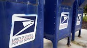 Mailboxes in Omaha, Neb., Tuesday, Aug. 18, 2020. The Postmaster general announced Tuesday he is halting some operational changes to mail delivery tha
