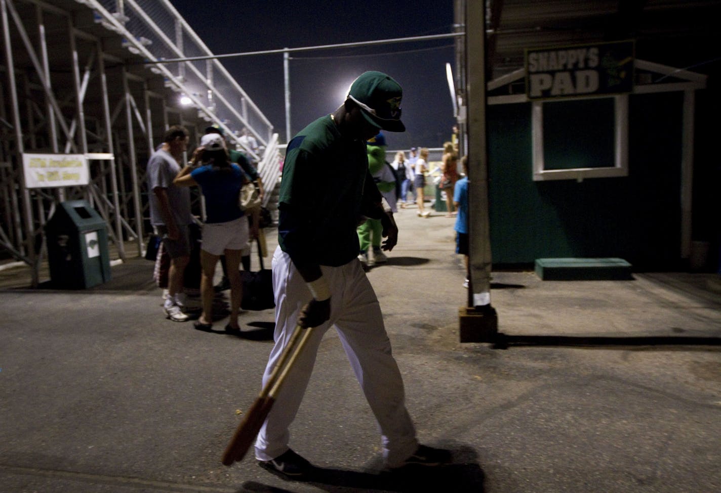 Miguel Sano heads to the locker room after beating the Burlington Bees in 2012.