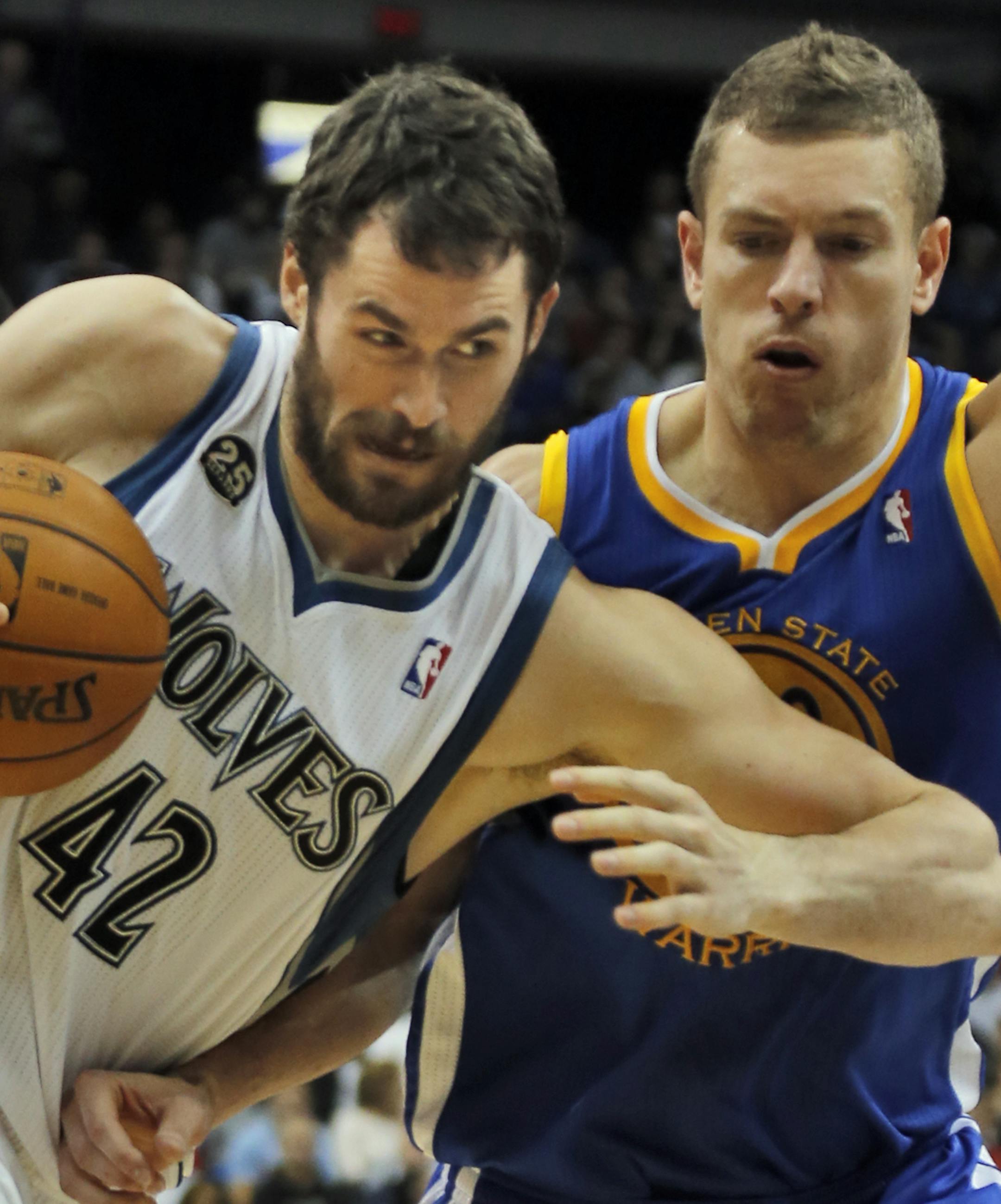 Golden State vs Minnesota Timberwolves. Golden State won 106 - 93. Wolves Kevin Love was fouled by Warriors David Lee as he drove to the basket. (MARLIN LEVISON/STARTRIBUNE(mlevison@startribune.com)