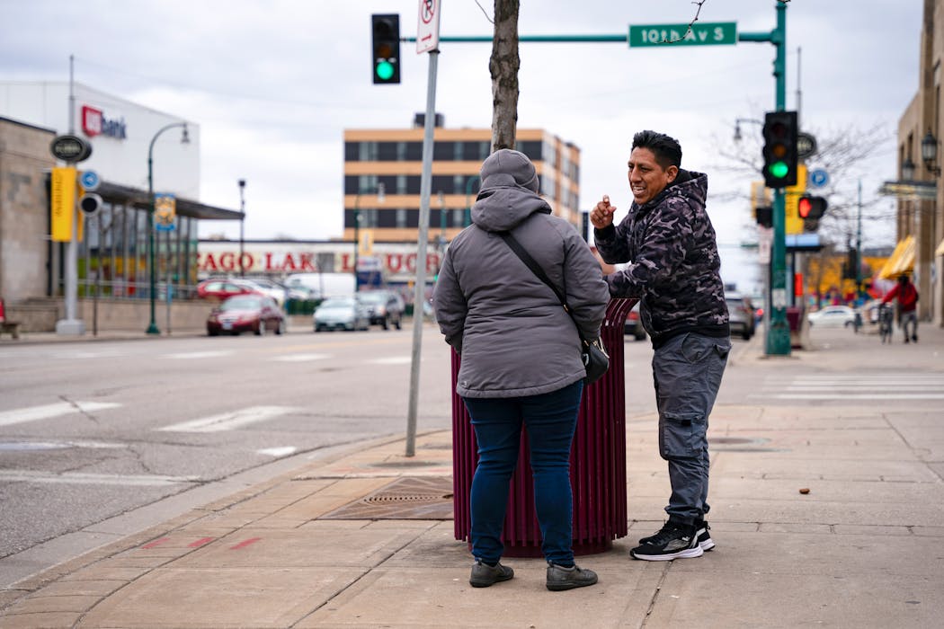 Maria Zavala talks to a man digging in a trash can to see if he needs any help. Though he was just looking for a ticket he accidentally threw away, Zavala checks in with anyone who seems like they might be in need.