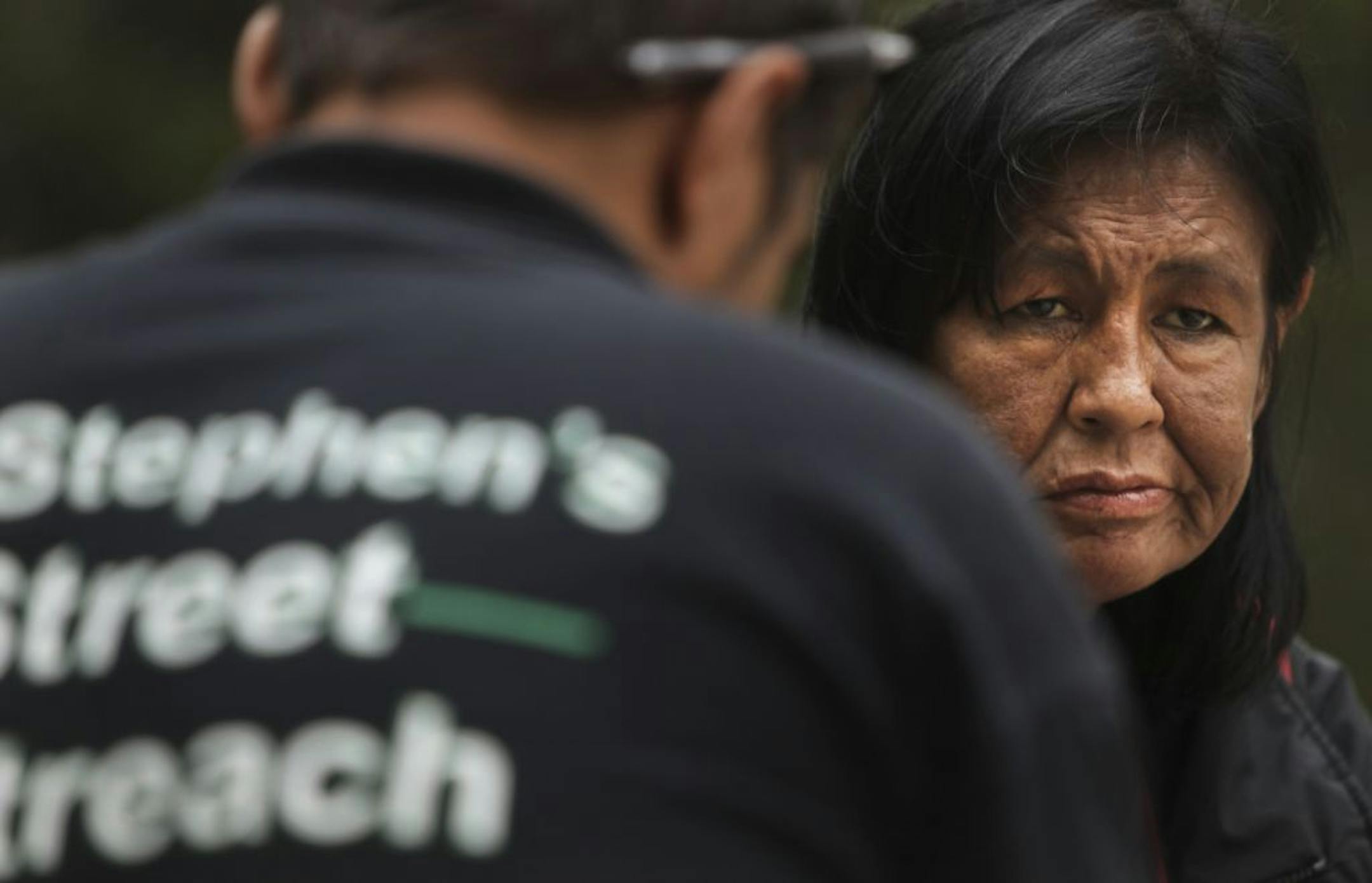 The outreach workers at St. Stephen's Human Services regularly canvass downtown for the homeless and try to offer them advice and services. Joseph Desenclos, left, a St. Stephen's worker, recently met with Pam Cobenais, who has been homeless off and on for 10 years.