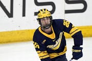 Michigan’s Seamus Casey, seen Nov. 4 in Madison, Wis., scored on Gophers goaltender Justen Close to help his team win the shootout.