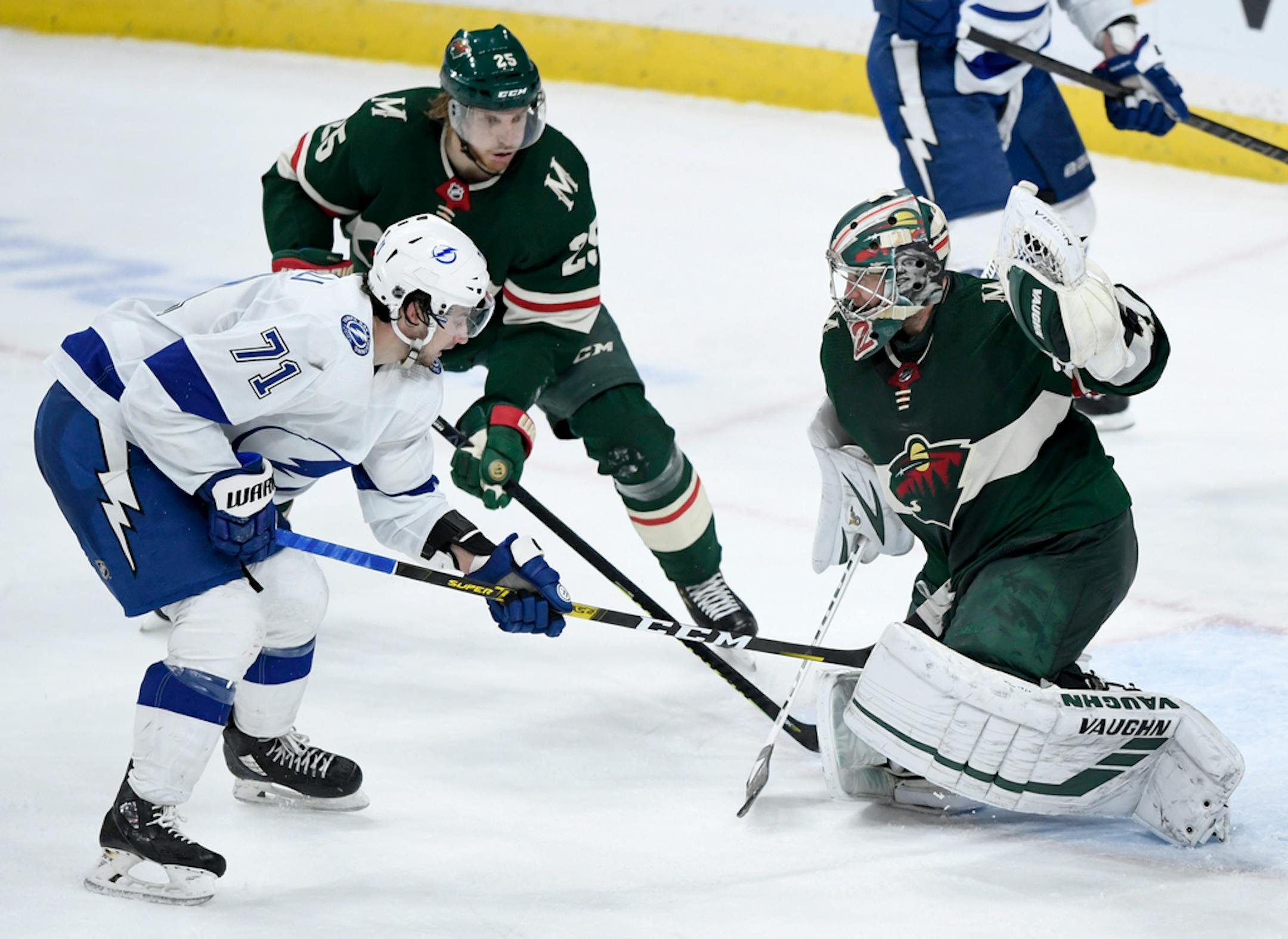 Minnesota Wild goaltender Alex Stalock (32) stops the shot by Tampa Bay Lightning's Anthony Cirelli (71) with help from defenseman Jonas Brodin (25), of Sweden, during the third period of an NHL hockey game Thursday, Jan. 16, 2020, in St. Paul, Minn. The Wild won 3-2. (AP Photo/Hannah Foslien)