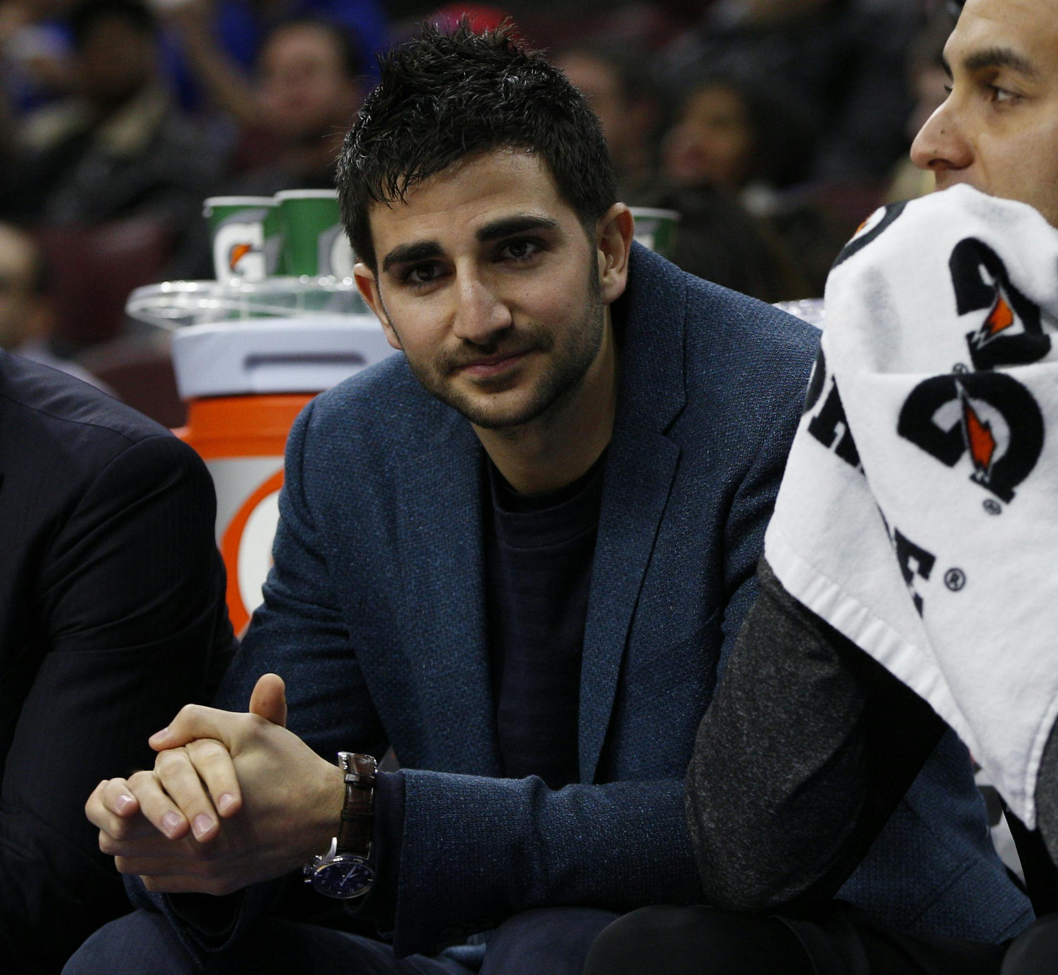 Minnesota Timberwolves' Ricky Rubio (9) of Spain looks on in street clothes with Kevin Martin (23) during the first half of an NBA basketball game against the Philadelphia 76ers, Friday, Jan. 30, 2015, in Philadelphia. The 76ers won 103-94. (AP Photo/Chris Szagola)