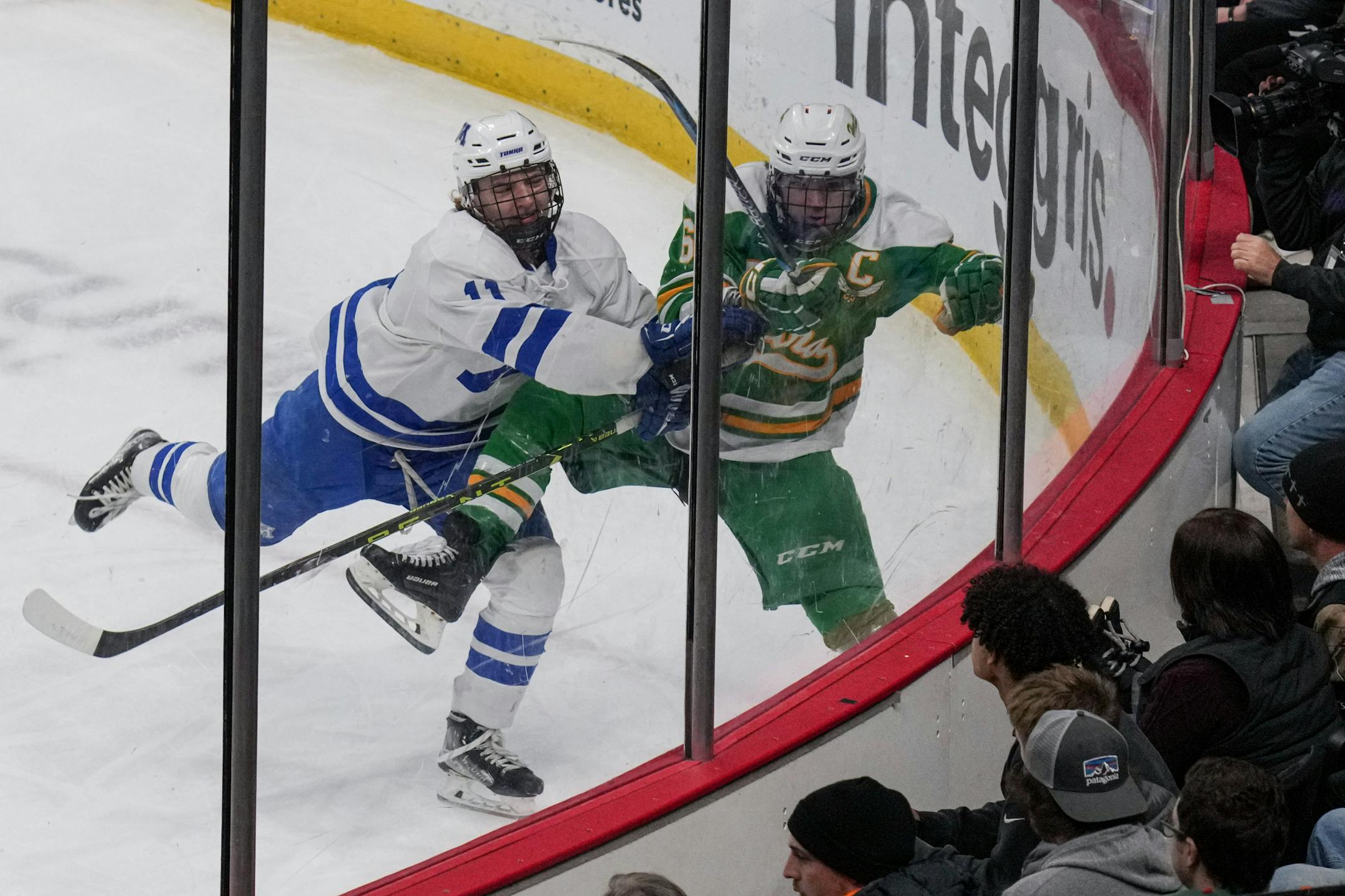 Minnetonka forward Ashton Schultz (11) slammed Edina defenseman Eddie Revenig (6) in the second period.