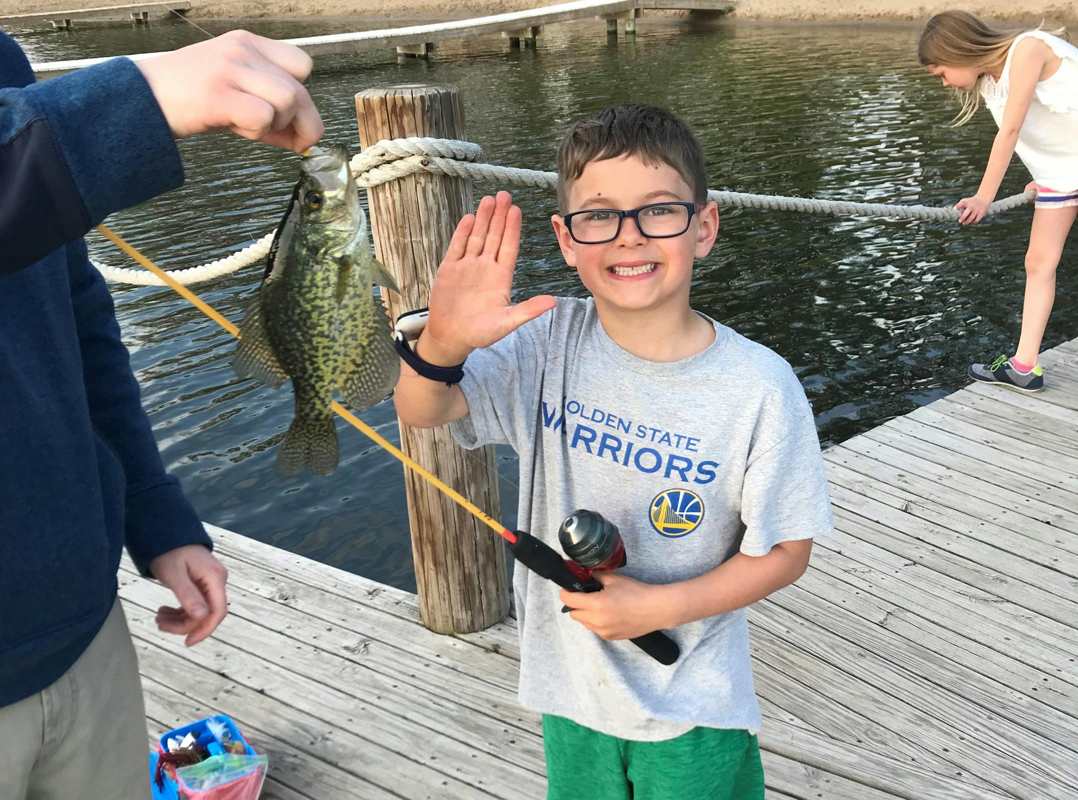 Nicolas Selinger, age 7, of Deephaven, caught this 10-inch crappie May 14 from the dock at Deephaven Beach using canned corn.