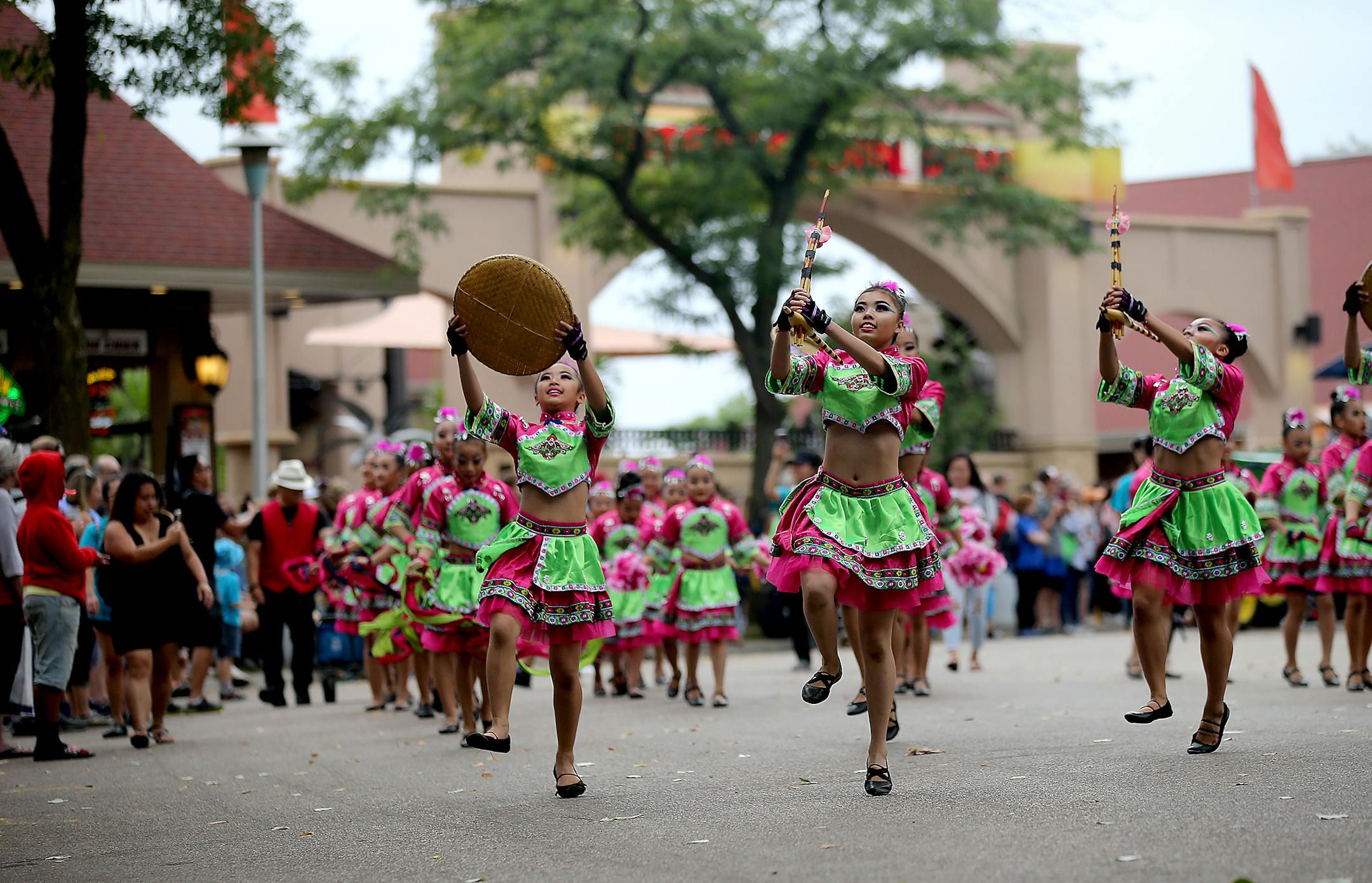 Dancers from the Community School of Excellence, a K-8 Hmong language and culture school, make their way along the parade route during the last day of the Minnesota State Fair Monday, May, Sept. 3, 3018, in Falcon Heights, MN.]
