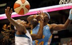 Rebekkah Brunson (32) attempted a shot while being defended by Sylvia Fowles (34) in the first quarter. ] CARLOS GONZALEZ * cgonzalez@startribune.com 
