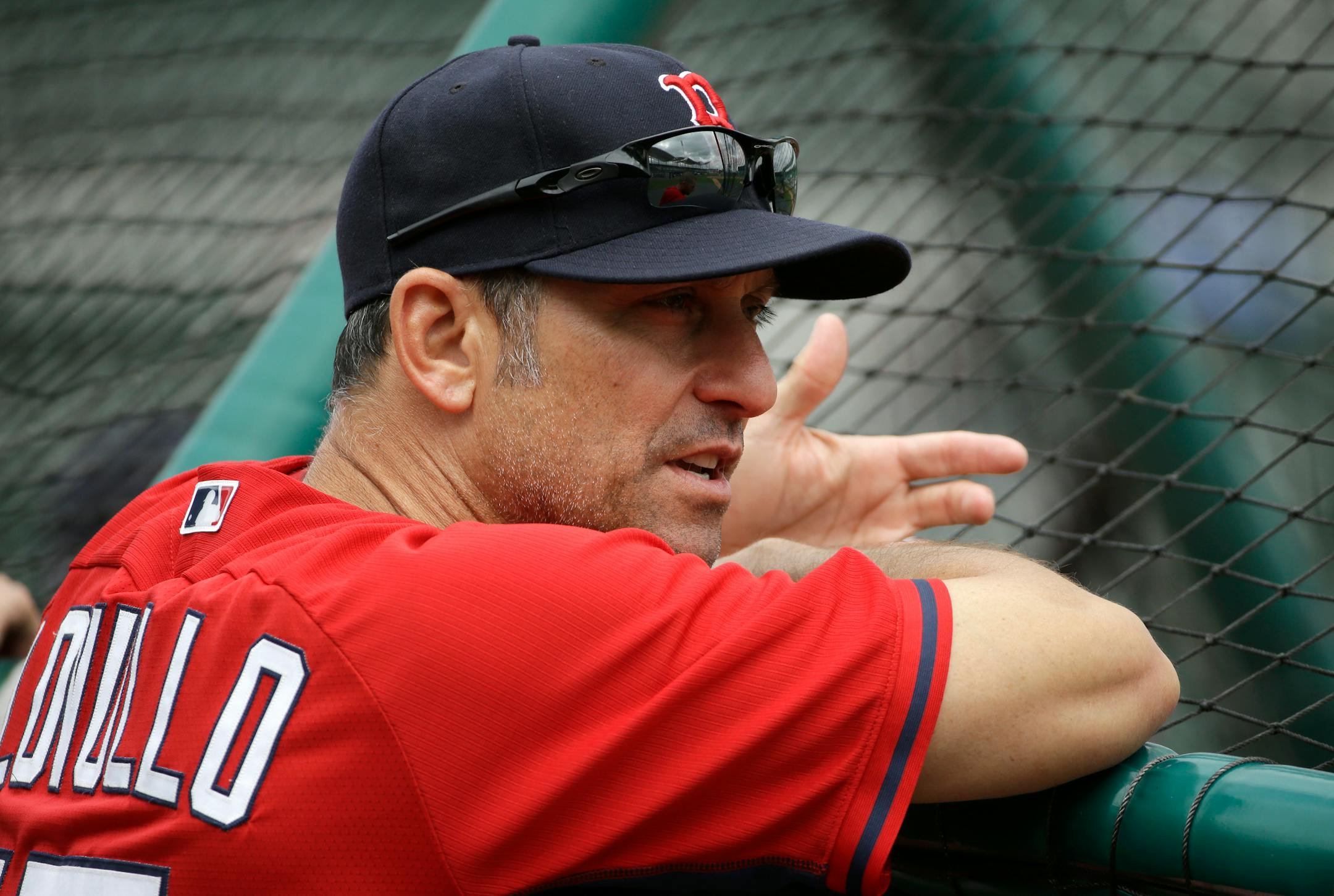 Boston Red Sox bench coach Torey Lovullo speaks with players before an exhibition baseball game Friday, March 7, 2014, in Fort, Myers, Fla. (AP Photo/Steven Senne) ORG XMIT: FLSR