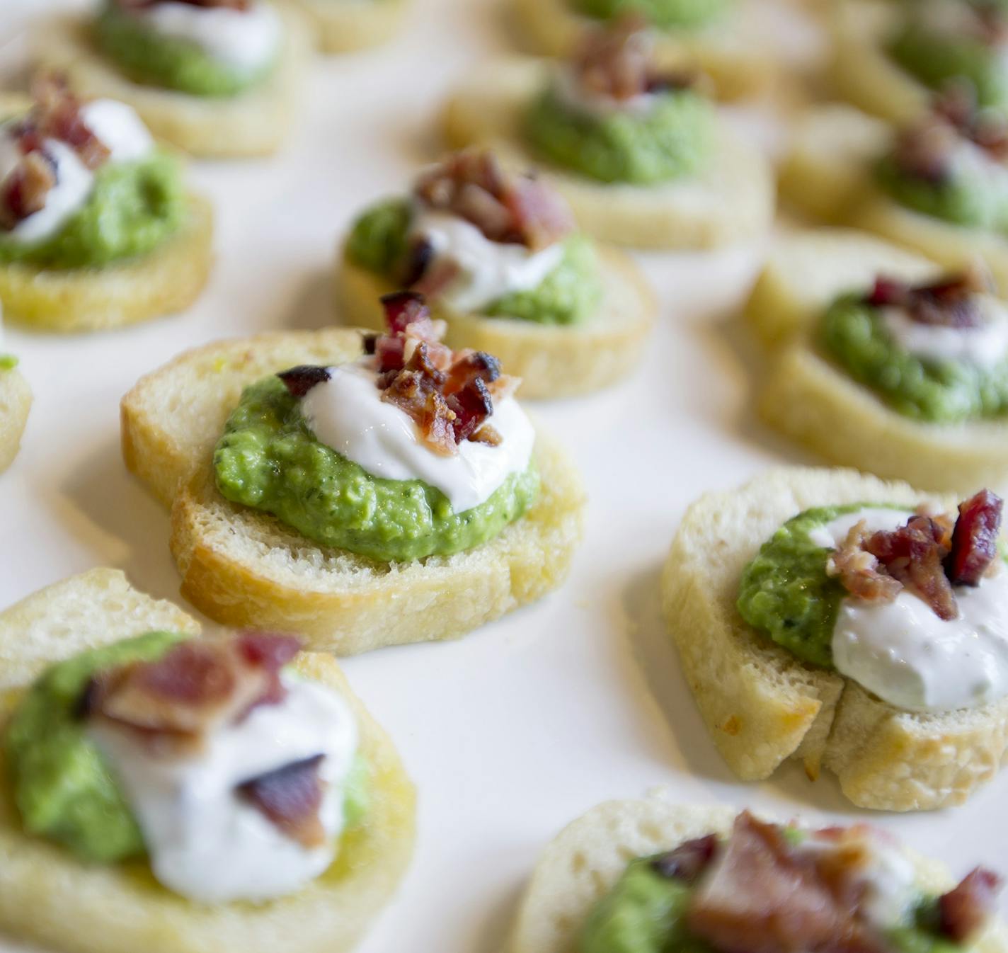 Customers learned how to make minted pea puree with chive cream during the Lunch Counter demo class at Cooks of Crocus Hill in Stillwater June 27, 2014. (Courtney Perry/Special to the Star Tribune)