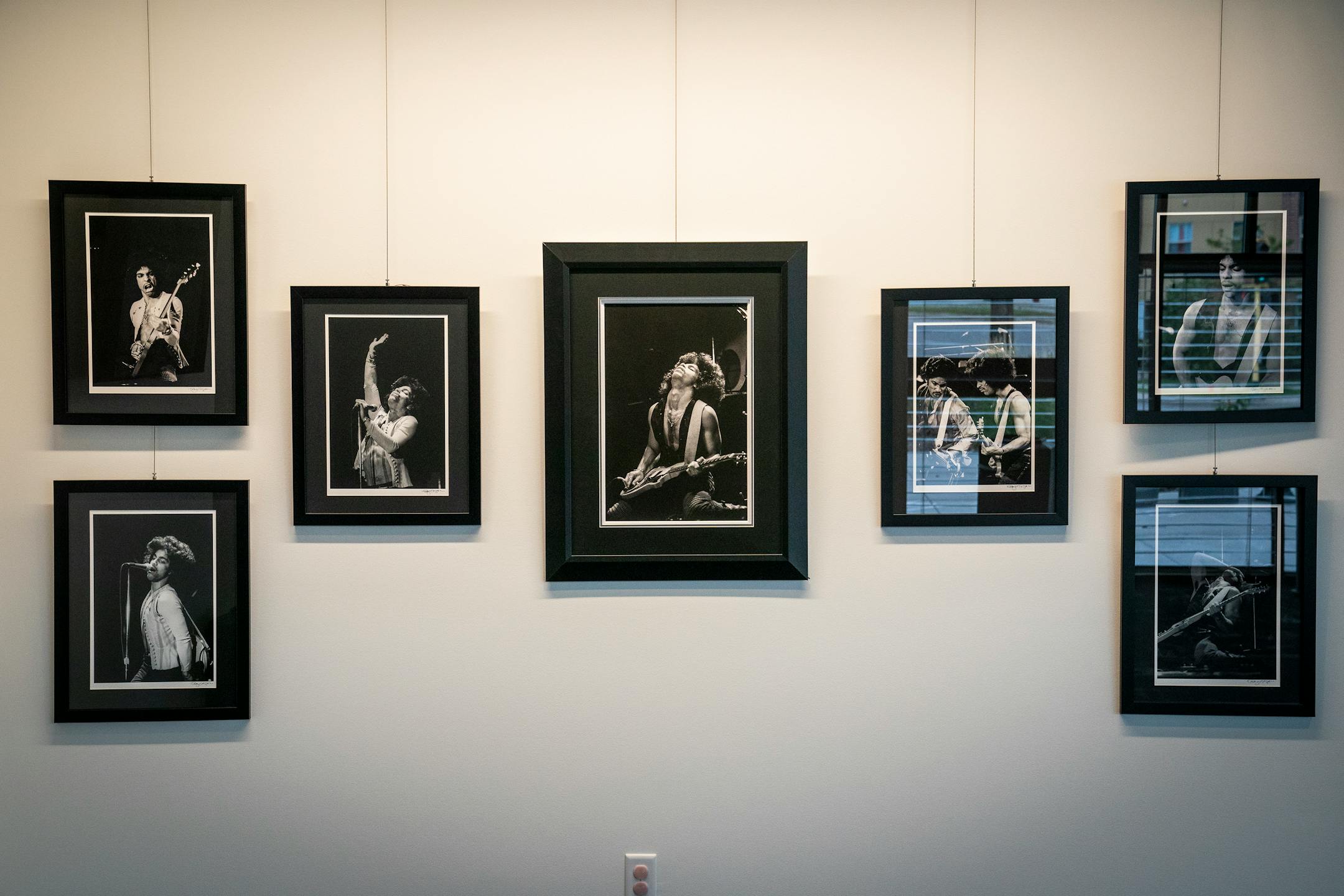Photographs of Prince performing his first show as a solo artist at the Capri Theater hang in the lobby of the renovated Capri Theater.