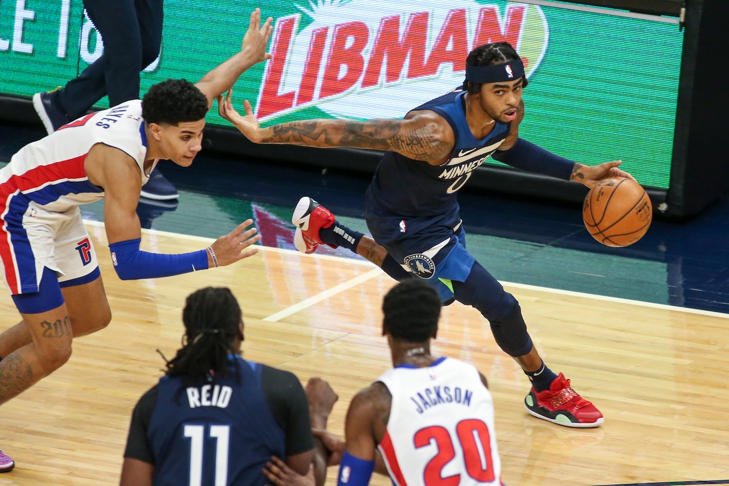 Minnesota Timberwolves guard D'Angelo Russell (0) drives on Detroit Pistons guard Killian Hayes during an NBA basketball game, Wednesday, Dec. 23, 2020, in Minneapolis. (AP Photo/Andy Clayton- King) ORG XMIT: MERafb653b984d9fa7dc22d71f629d4c