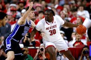 DJ Burns Jr., right, is making a big impact for N.C. State after transferring in from Winthrop two years ago.