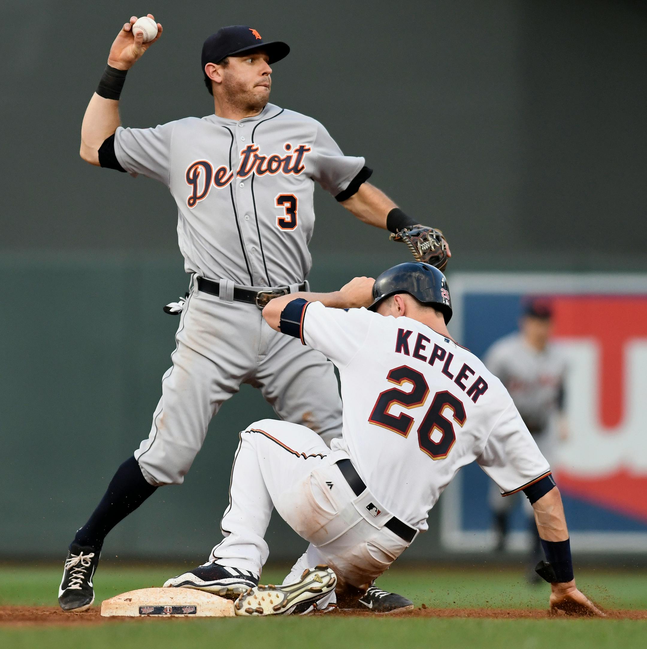 Detroit Tigers second baseman Ian Kinsler (3) gets the force out at second as Minnesota Twins' Max Kepler (26) slides during the fourth inning of a baseball game Saturday, July 22, 2017, in Minneapolis. Joe Mauer was safe at first. (AP Photo/Tom Olmscheid)