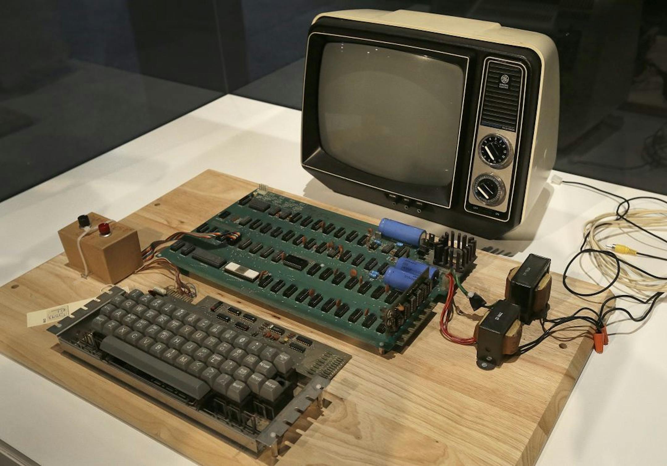 FILE - An Apple 1 computer for sale at auction is seen in a Monday, June 24, 2013 file photo, at the Computer History Museum in Menlo Park, Calif. The computer sold on Monday, Jully 8, 2013 for $387,750 at a Christie's online-only auction. The auction house did not disclose the name of the buyer.