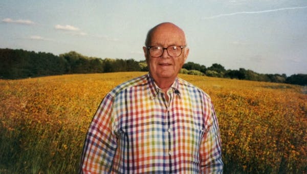 Doug Dayton standing in his prairie (55 acres) in a full summertime bloom 6 years ago. Restoring and maintaining his prairie was his passion. He found