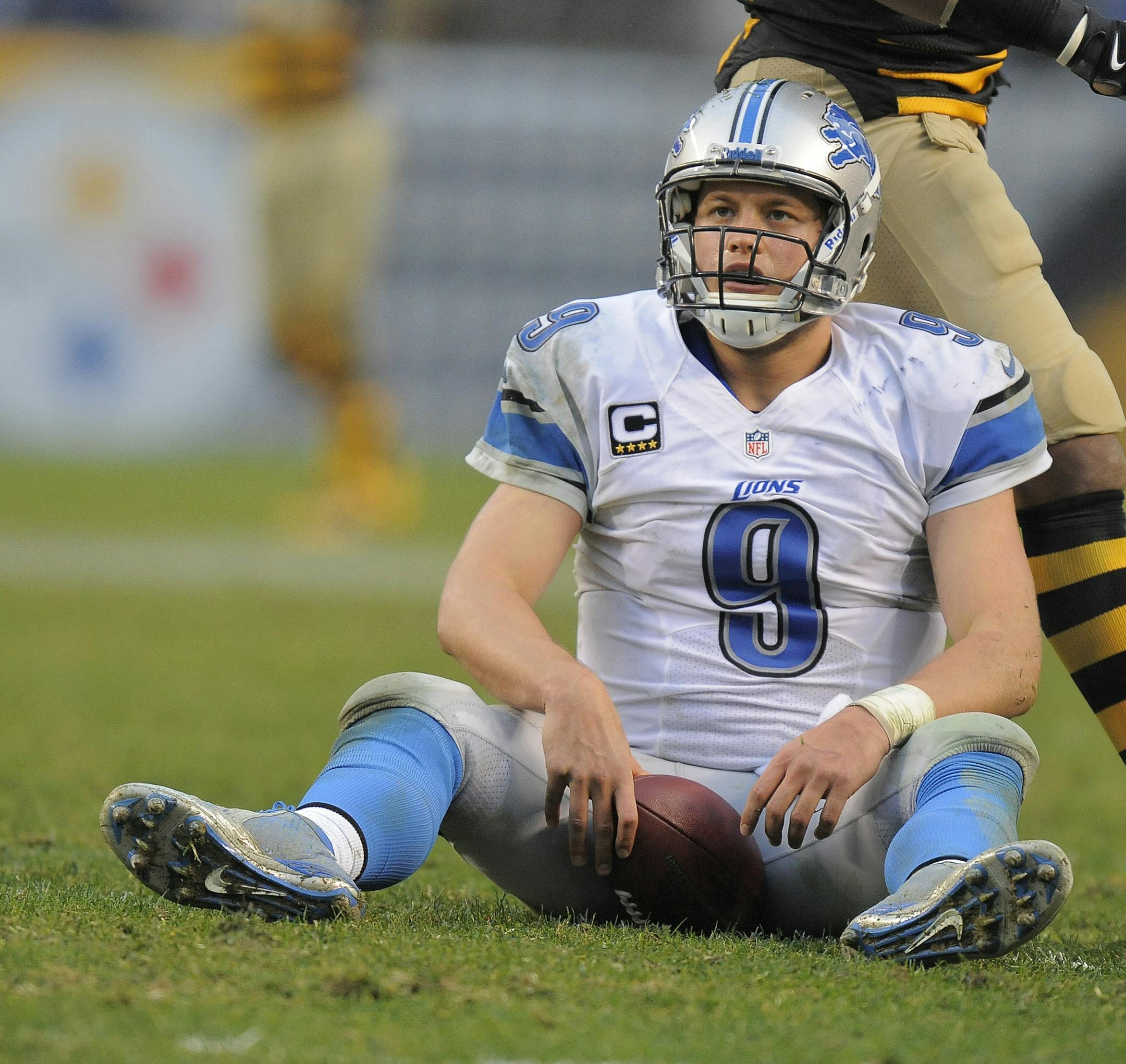 Detroit Lions quarterback Matthew Stafford (9) reacts to getting sacked by Pittsburgh Steelers defensive end Ziggy Hood (96) during the fourth quarter of an NFL football game on Sunday, Nov. 17, 2013, in Pittsburgh. Pittsburgh won 37-27.(AP Photo/Don Wright) ORG XMIT: OTK