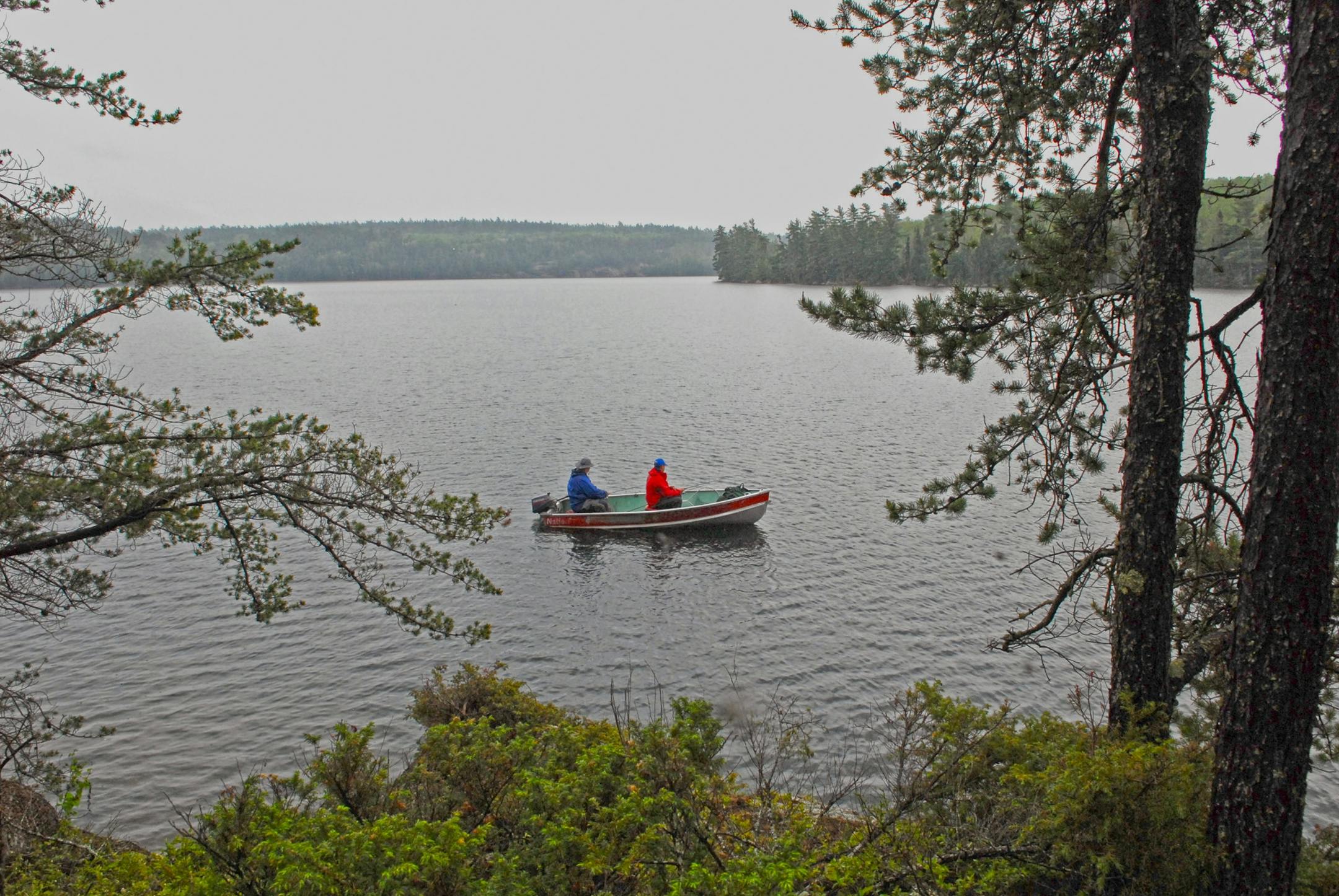 Bob Simmet, left, and his brother, Pete, both of Stillwater, troll for lake trout in Spring Lake on the Minnesota-Ontaro border. The lake was reached by a half-mile-long portage from Lac La Croix, which straddles the border. A resort keeps a boat and a canoe at the lake.