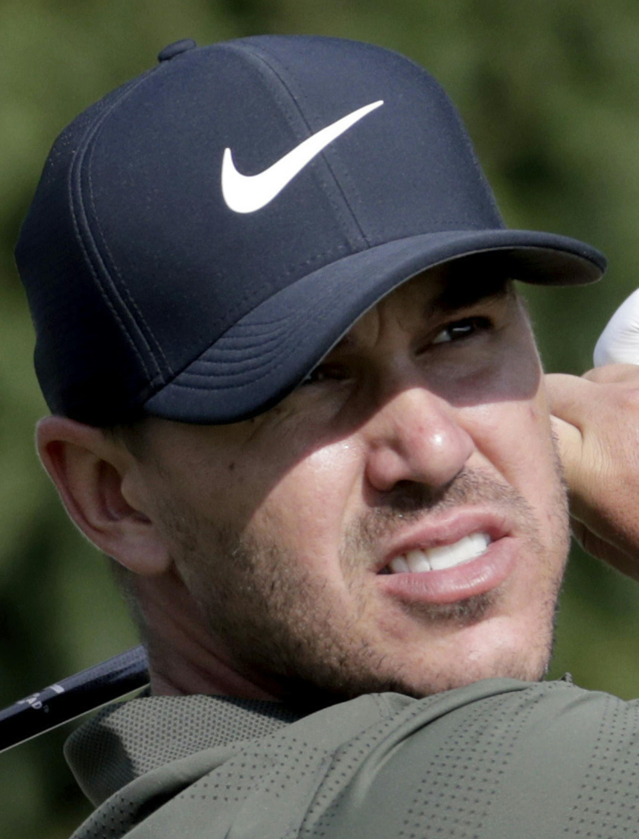 FILE - These are 2018 file photos showing members of the United States Ryder Cup team. They are Bryson Dechambeau, Tony Finau, Rickie Fowler, Dustin Johnson, Brooks Koepka, Phil Mickelson, Patrick Reed, Webb Simpson, Jordan Spieth, Justin Thomas, Bubba Watson and Tiger Woods. (AP Photo/File)