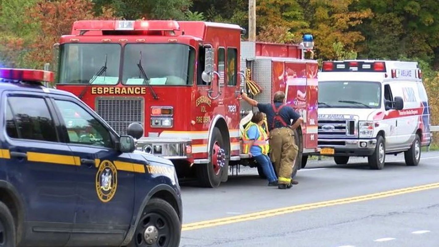 In this Saturday, Oct. 6, 2018 photo, emergency personnel respond to the scene of a deadly crash involving a limousine in Schoharie, N.Y.