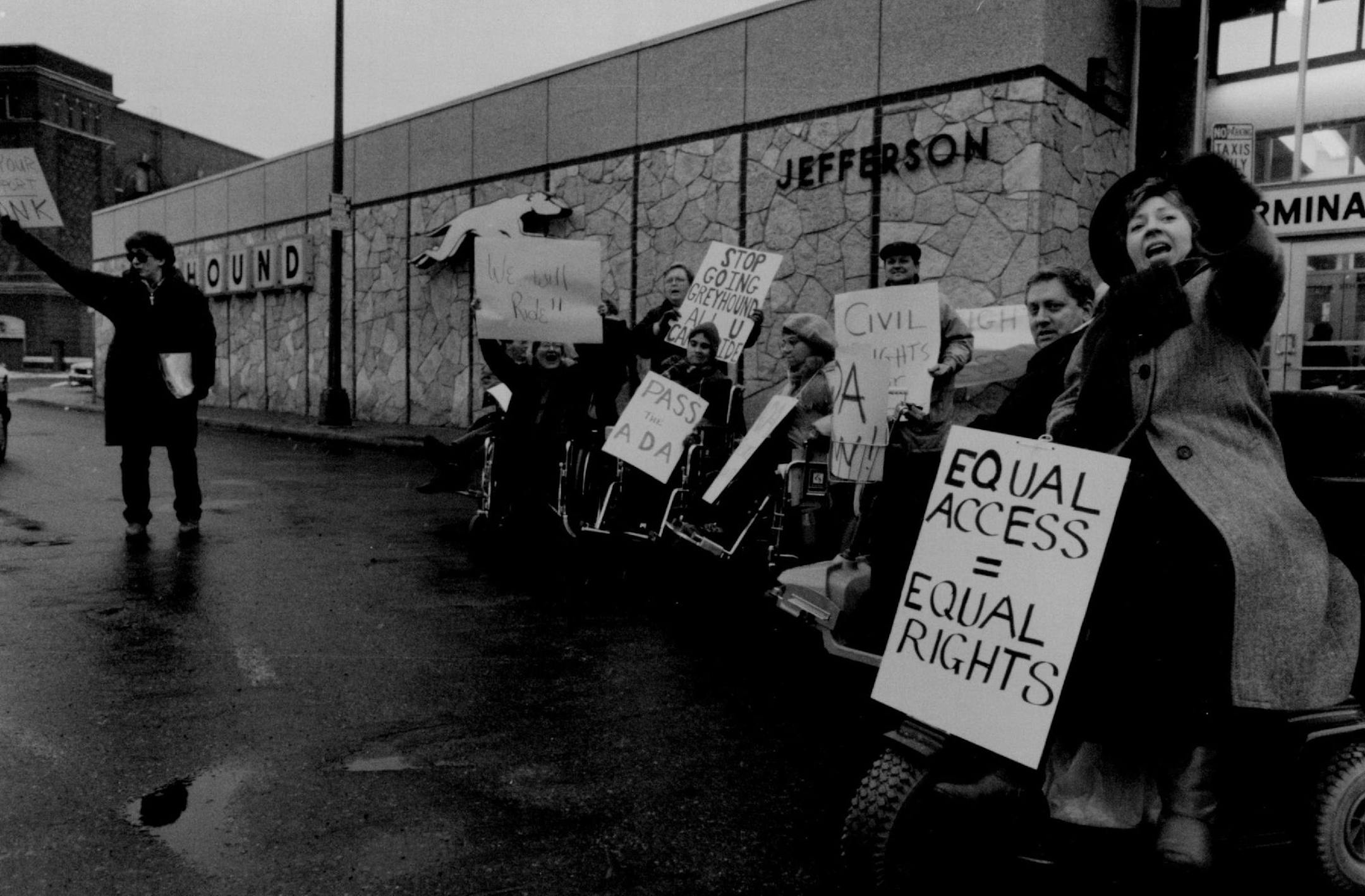 November 3, 1989 A dozen or so disabled persons demonstrated in front of the Greyhound Bus station. They were protesting Greyhounds opposition to the Americans with Disabilities Act currently being considered by Congress. They were also upset with Greyhound's failure to provide access for the disabled on busses and in stations. "I haven't been on a bus in 20 years," said Elin Ohlsson of the Minnesota Disability Law Center. (She's the woman in the foreground in a wheelchair.) Duane Braley, Minnea