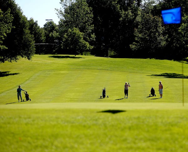 Women&#x2019;s golf league members play a round at Bloomington&#x2019;s Hyland Greens golf course July 28. The course has been operating in the red si