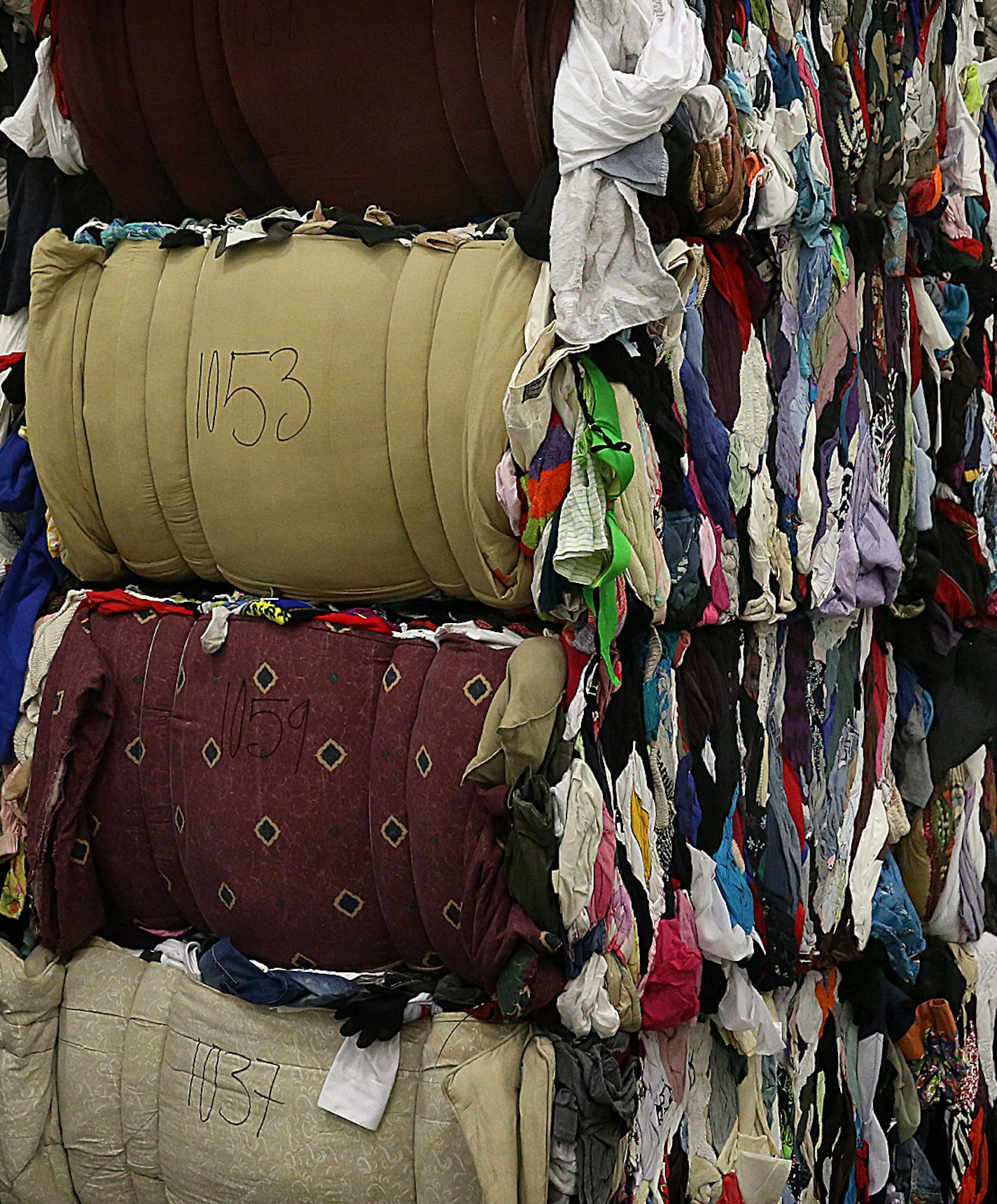 Clothing, whether stained, torn, gently-used or brand new, is packed into bails weighing between 1,000 and 1,150 pounds.