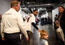 Twins pitcher Ervin Santana grabbed the hand of 3-year-old Hayden Gibson, daughter of pitcher Kyle Gibson, at TwinsFest on Jan. 19 at Target Field.