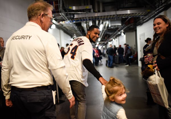 Twins pitcher Ervin Santana grabbed the hand of 3-year-old Hayden Gibson, daughter of pitcher Kyle Gibson, at TwinsFest on Jan. 19 at Target Field.