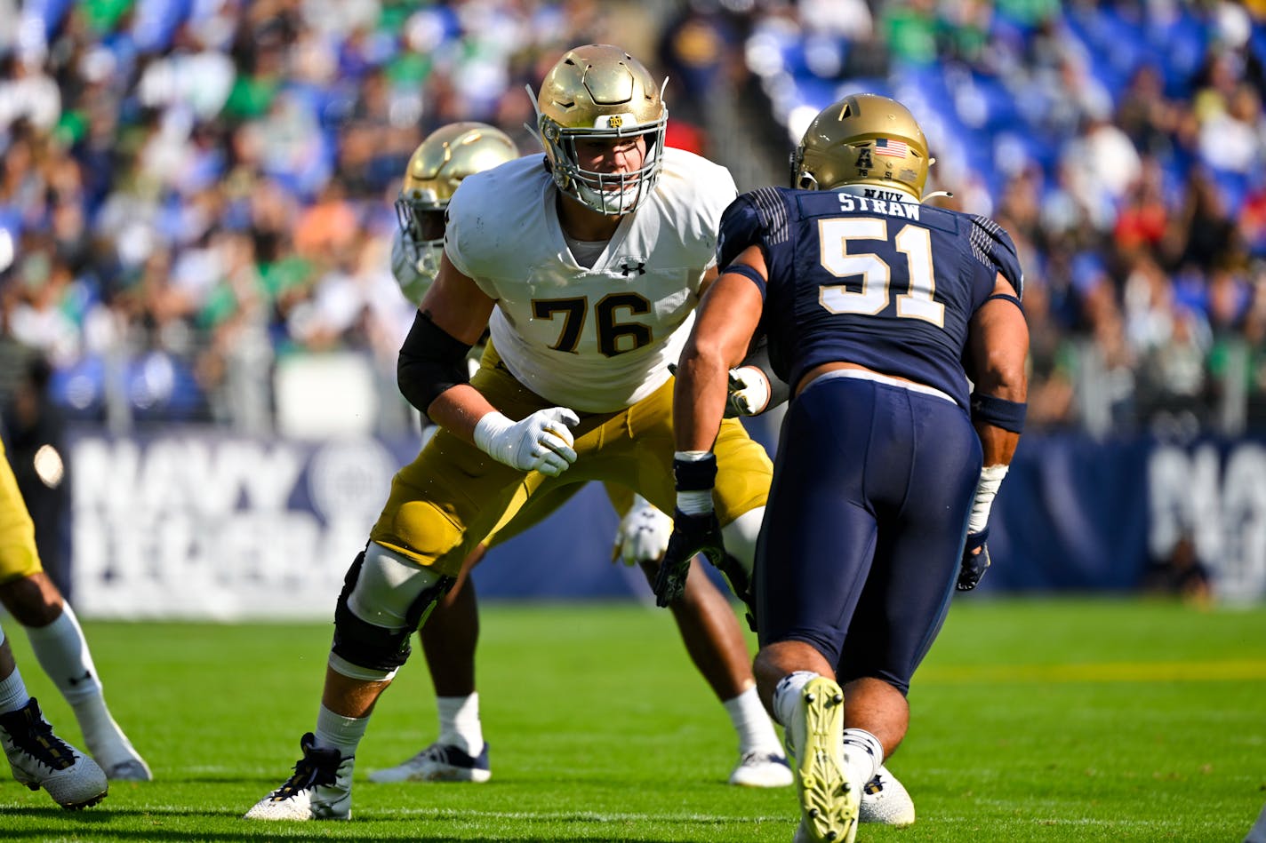 Notre Dame offensive lineman Joe Alt (76) in action against Navy linebacker Nicholas Straw (51) during the first half of an NCAA college football game, Saturday, Nov. 12, 2022, in Baltimore. (AP Photo/Terrance Williams)