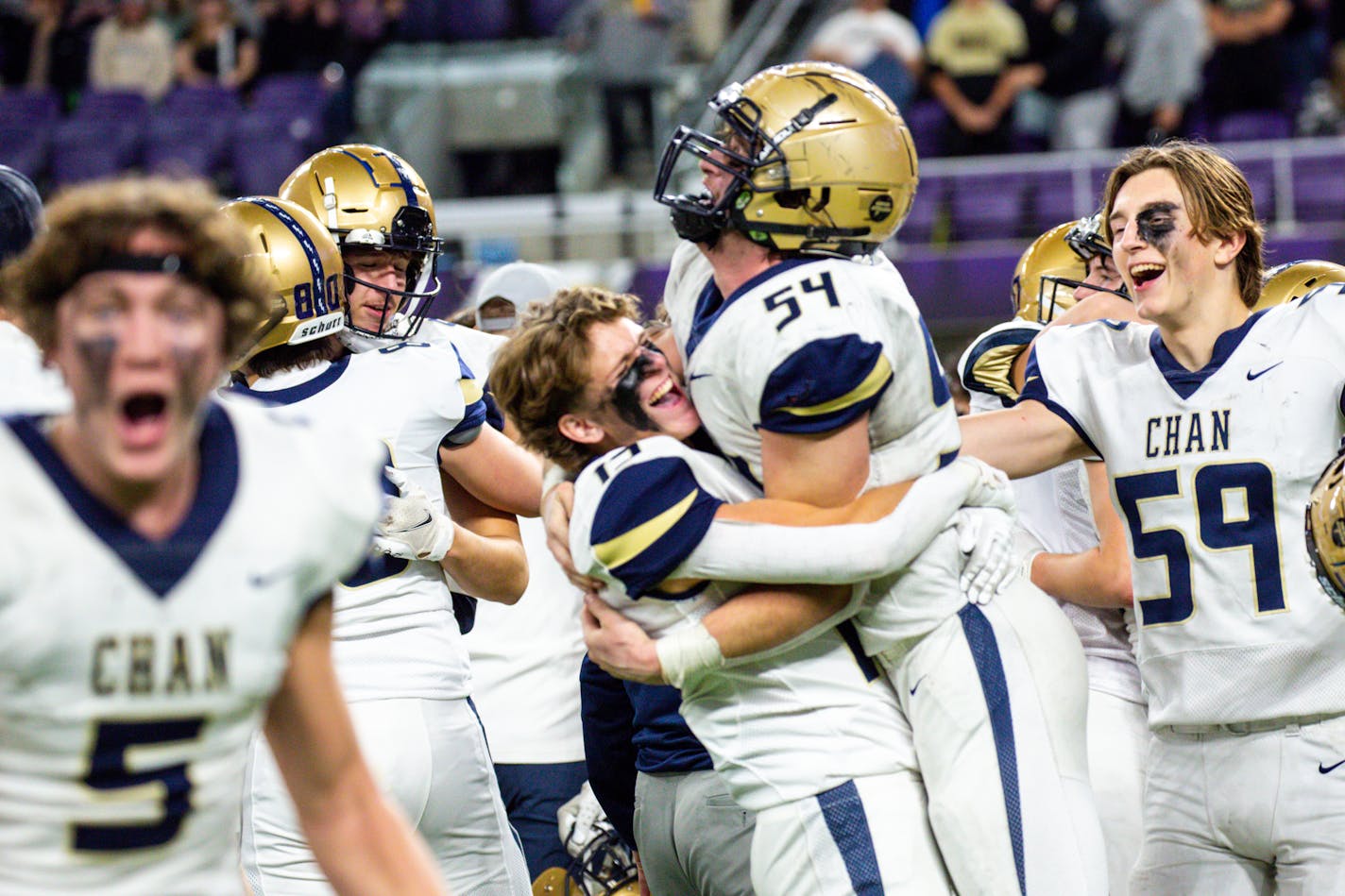 Chanhassen players celebrate after winning the Class 5A football state semifinals against Andover Saturday, Nov. 18, 2023 at U.S. Bank Stadium. Nicole Neri Special to the Star Tribune